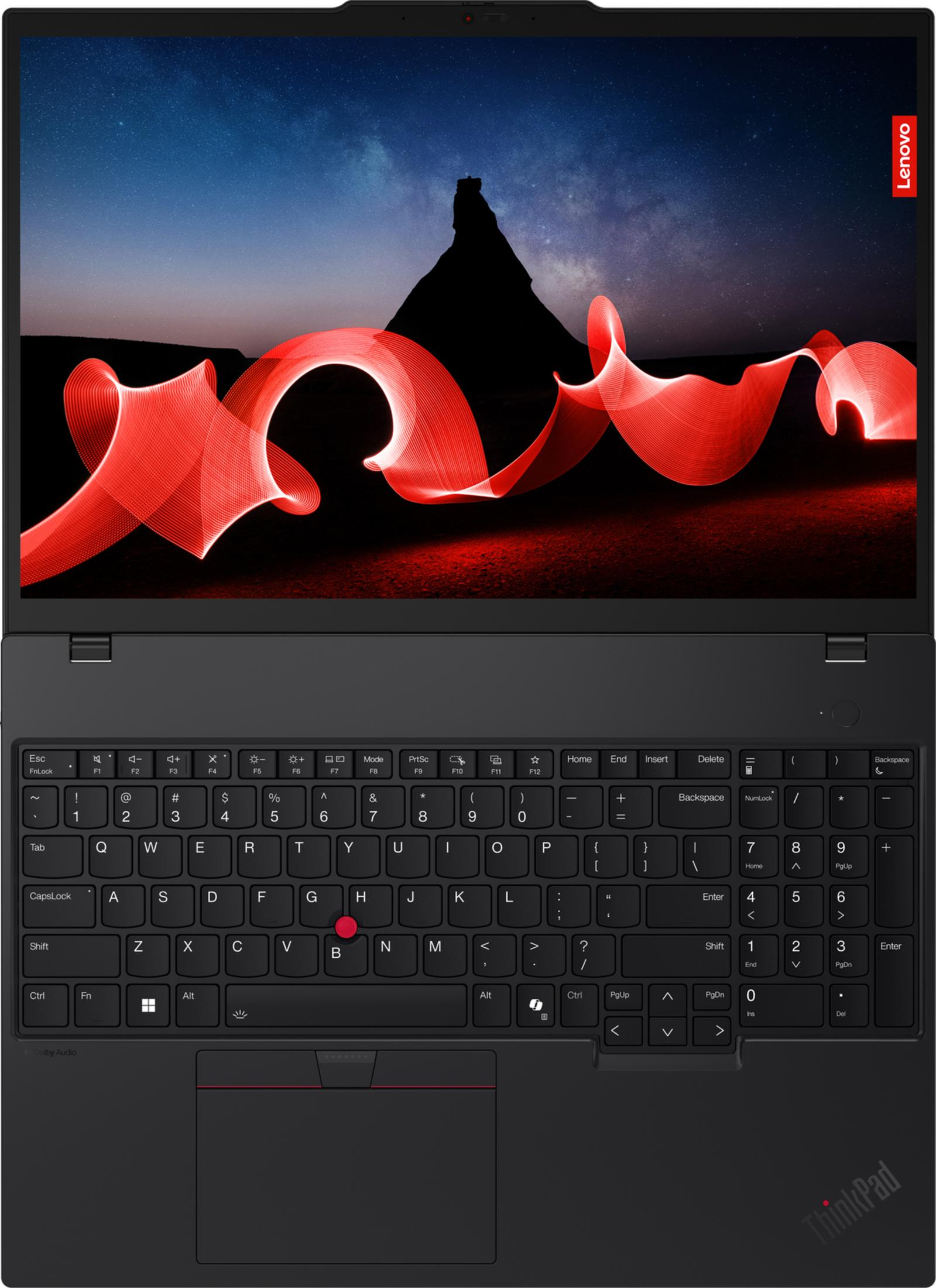 Un laptop aperto che mostra un cielo stellato e arte di luce rossa.