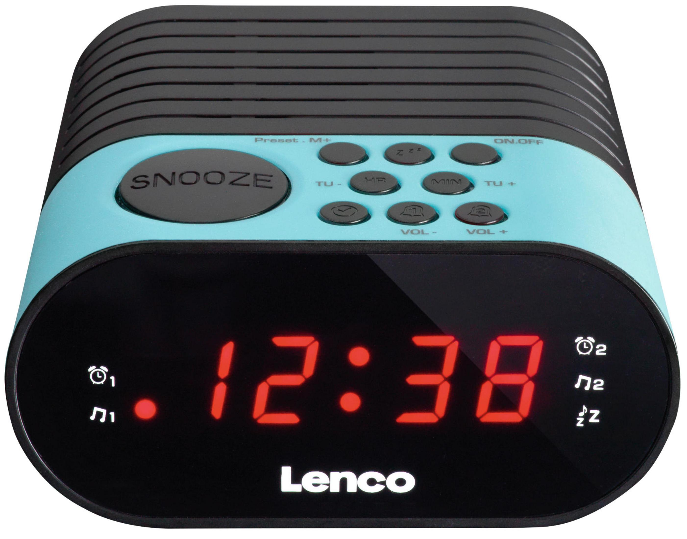 Niebieski budzik cyfrowy pokazuje 12:38. Przycisk drzemki na górze.