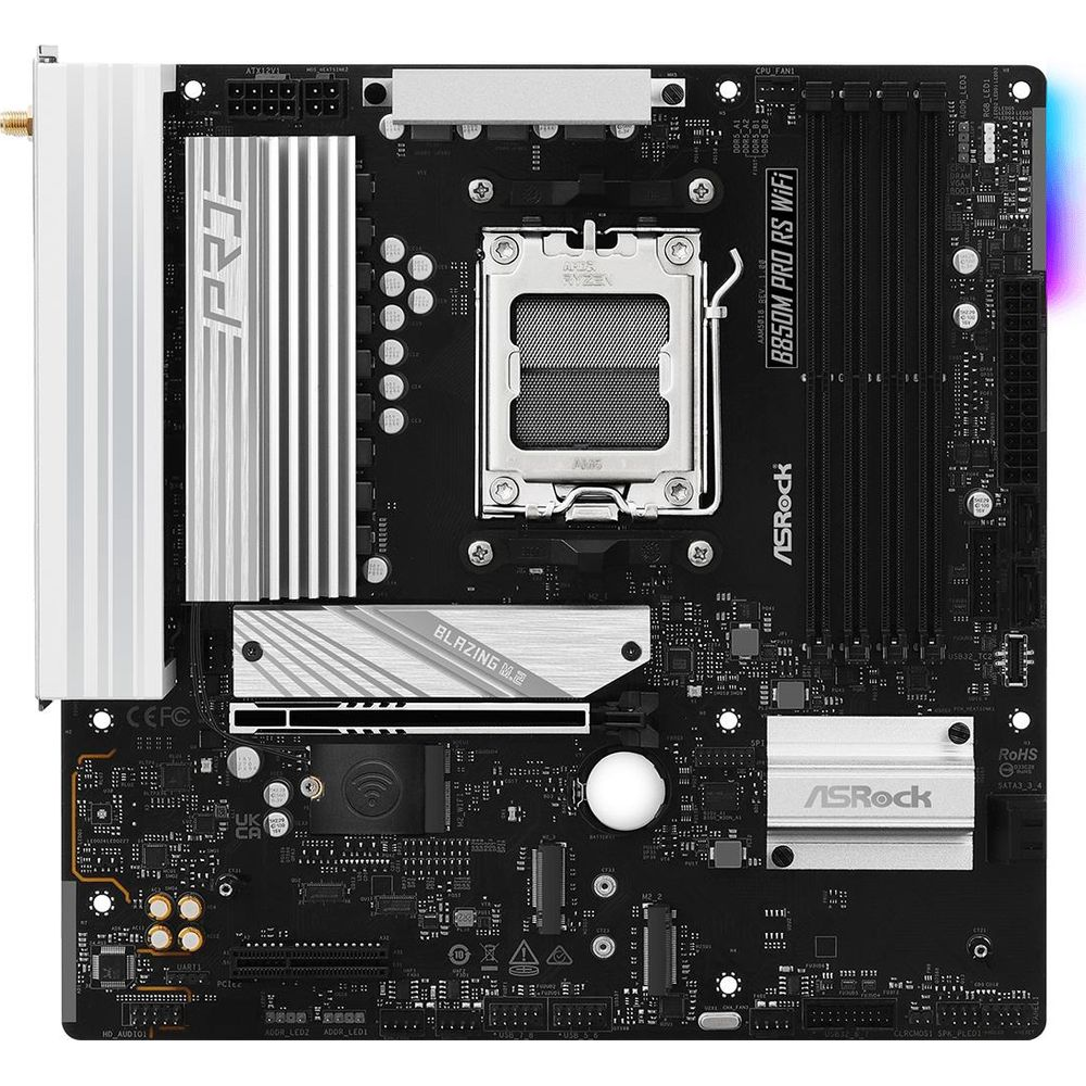 Czarno-szara płyta główna z gniazdem CPU, slotami RAM i radiatorami.