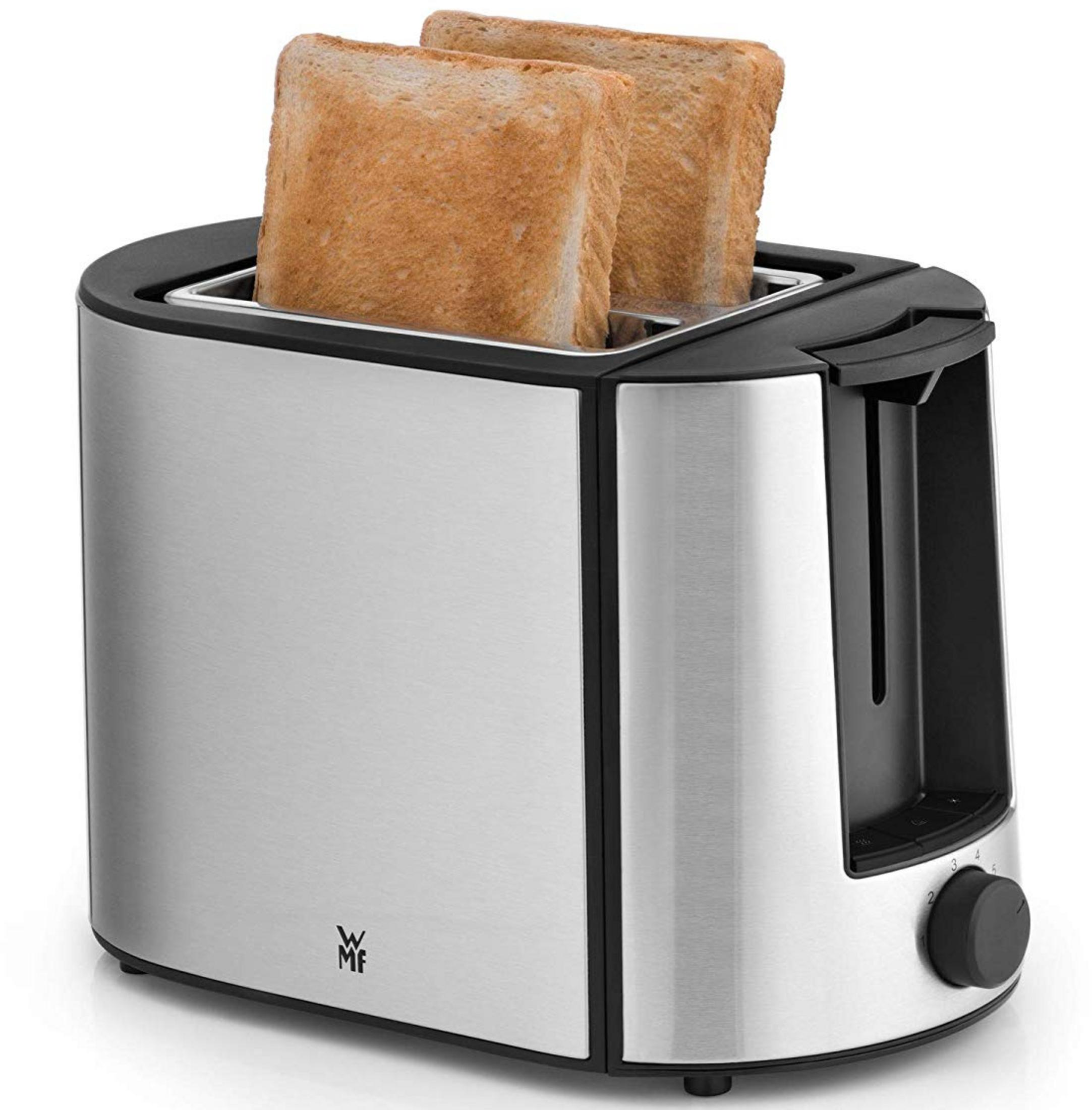 Srebrny toster z dwoma wystającymi kromkami tostów.