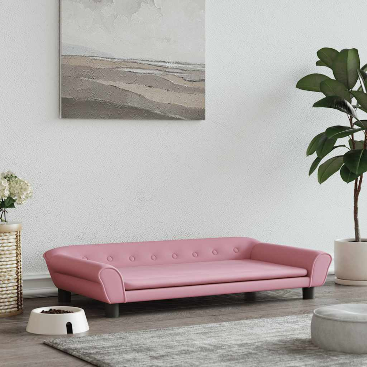 Rosa getuftetes Haustier-Sofa mit weißem Hundenapf, Pflanze und abstrakter Kunst.