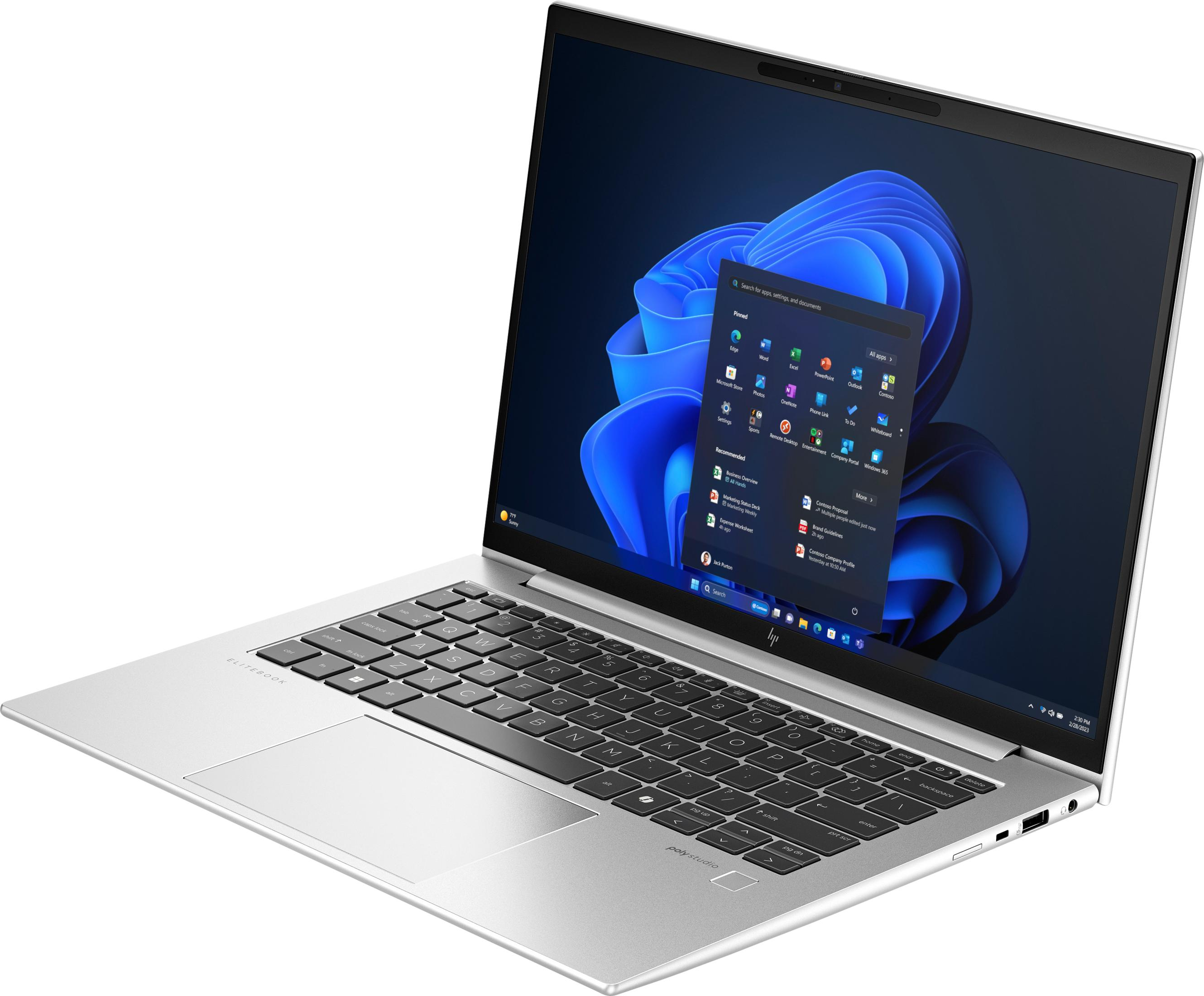Ein silberner Laptop mit einem schwarzen Bildschirm, der Windows 11 anzeigt.