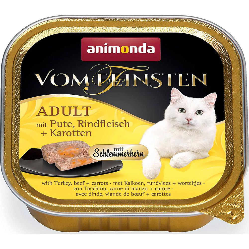 Karma dla kota Animonda: Biały kocur obok dwóch kawałków karmy z marchewką.