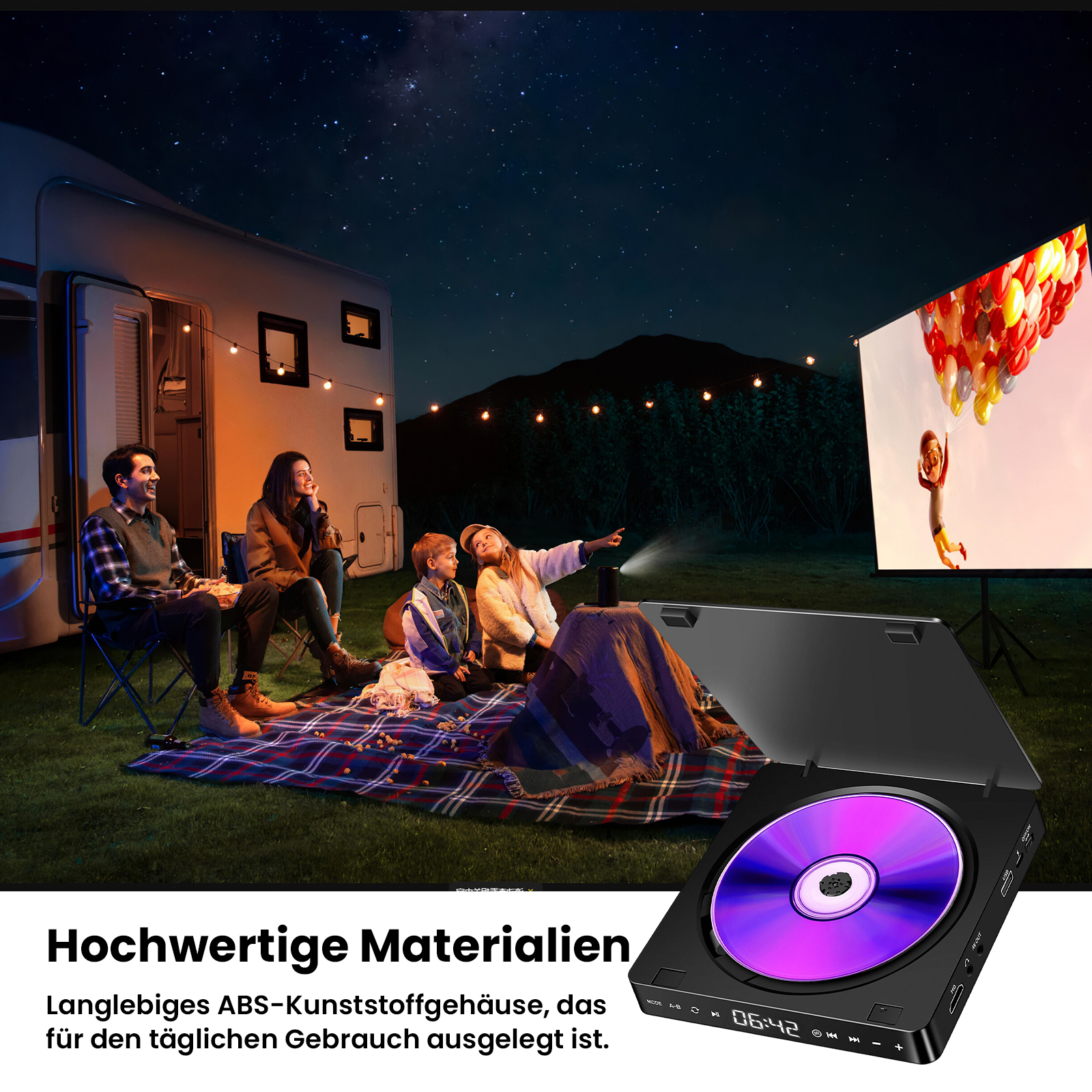 Familie schaut nachts einen Film vor einem Wohnmobil unter Sternenhimmel.