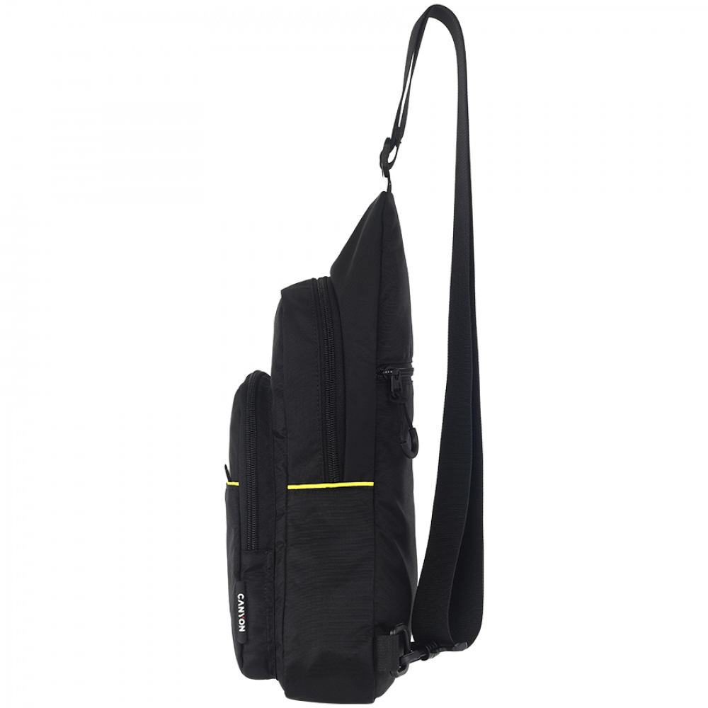 Czarna torba na ramię z żółtymi akcentami i długim paskiem.