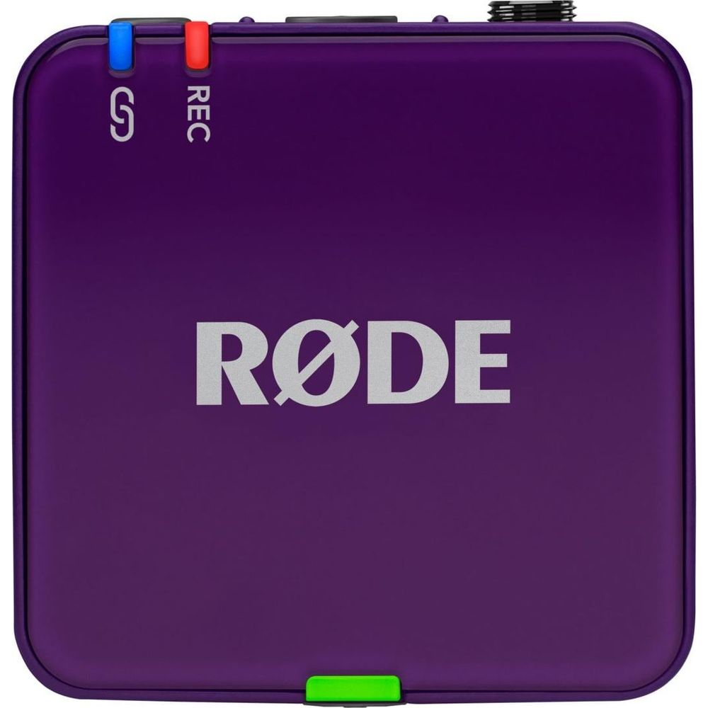 Fioletowe urządzenie RØDE ze wskaźnikami S i REC oraz zielonym przełącznikiem.