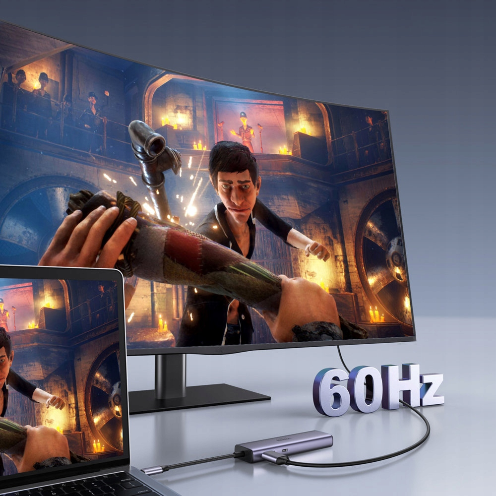 Laptop podłączony do dużego zakrzywionego monitora wyświetlającego grę. Tekst 60Hz.