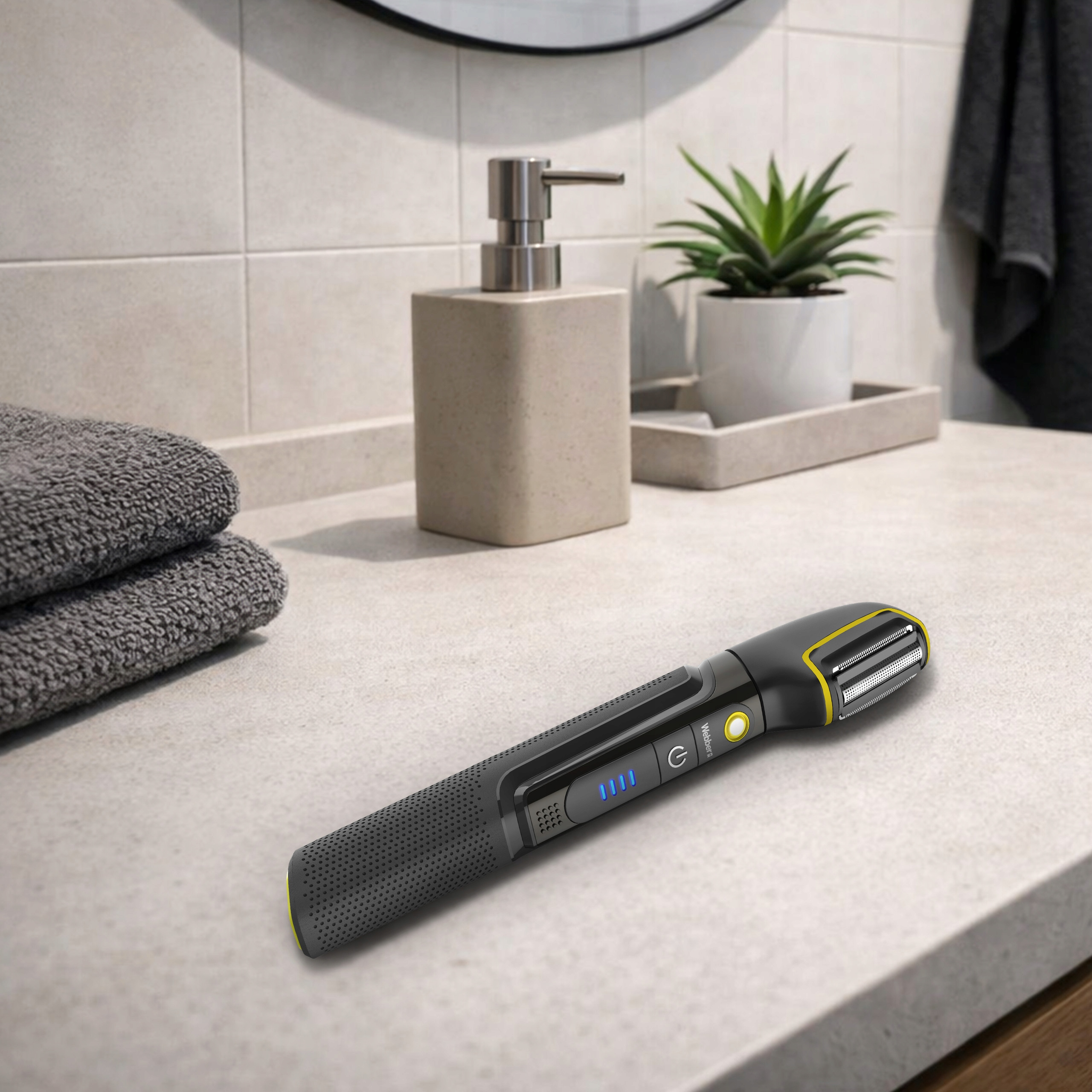 Ciemna golarka elektryczna z żółtymi akcentami leży na blacie.