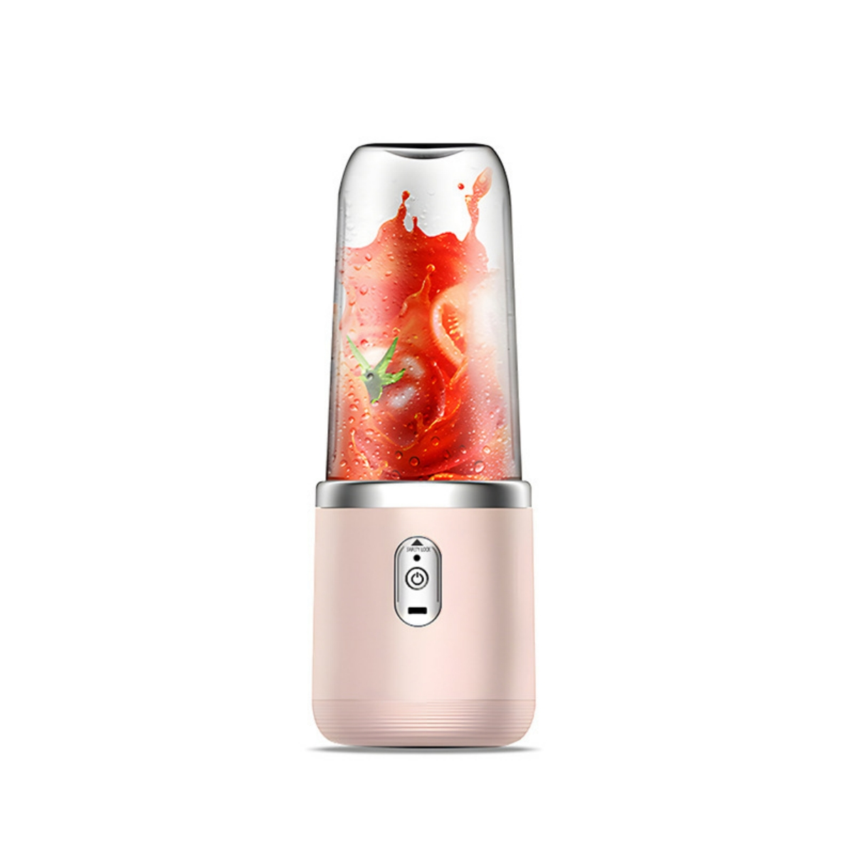 Ein tragbarer Mixer mit einem Glasbehälter, der Tomaten und Spritzer enthält.