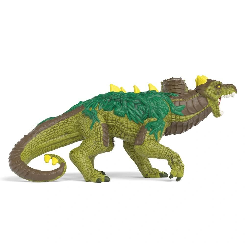 Grüne Dinosaurierfigur mit gelben Stacheln und braunen Panzerplatten.