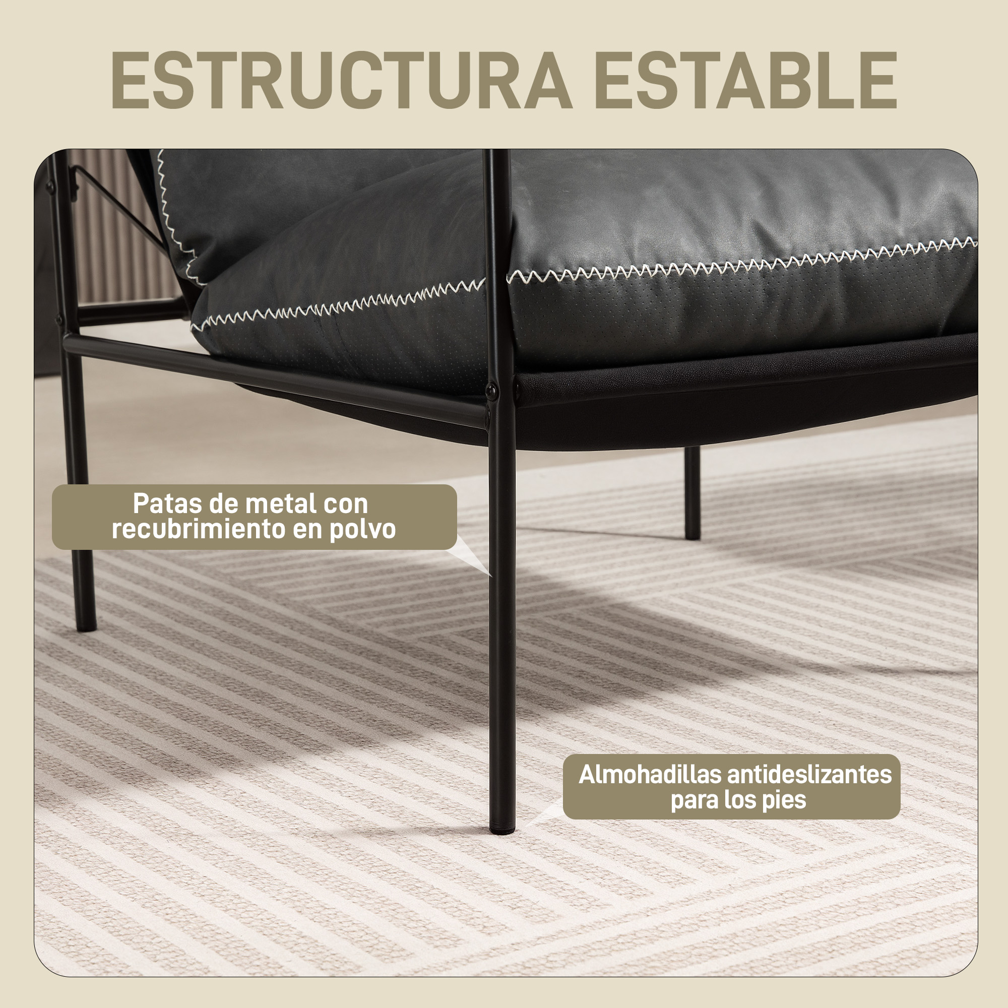 Sillón negro con patas de metal y costuras blancas sobre alfombra.