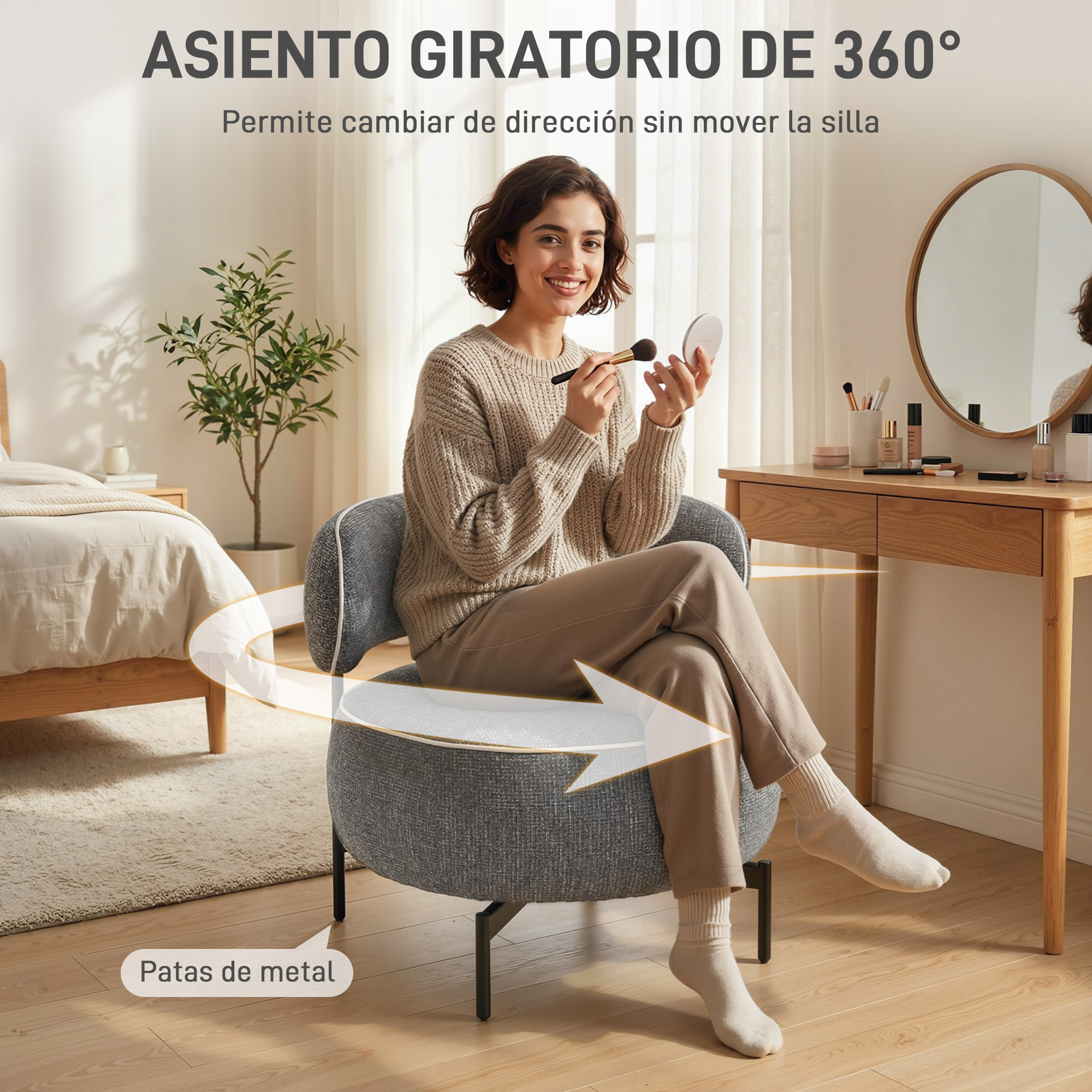 Mujer en silla gris con artículos de maquillaje, dormitorio y tocador al fondo.
