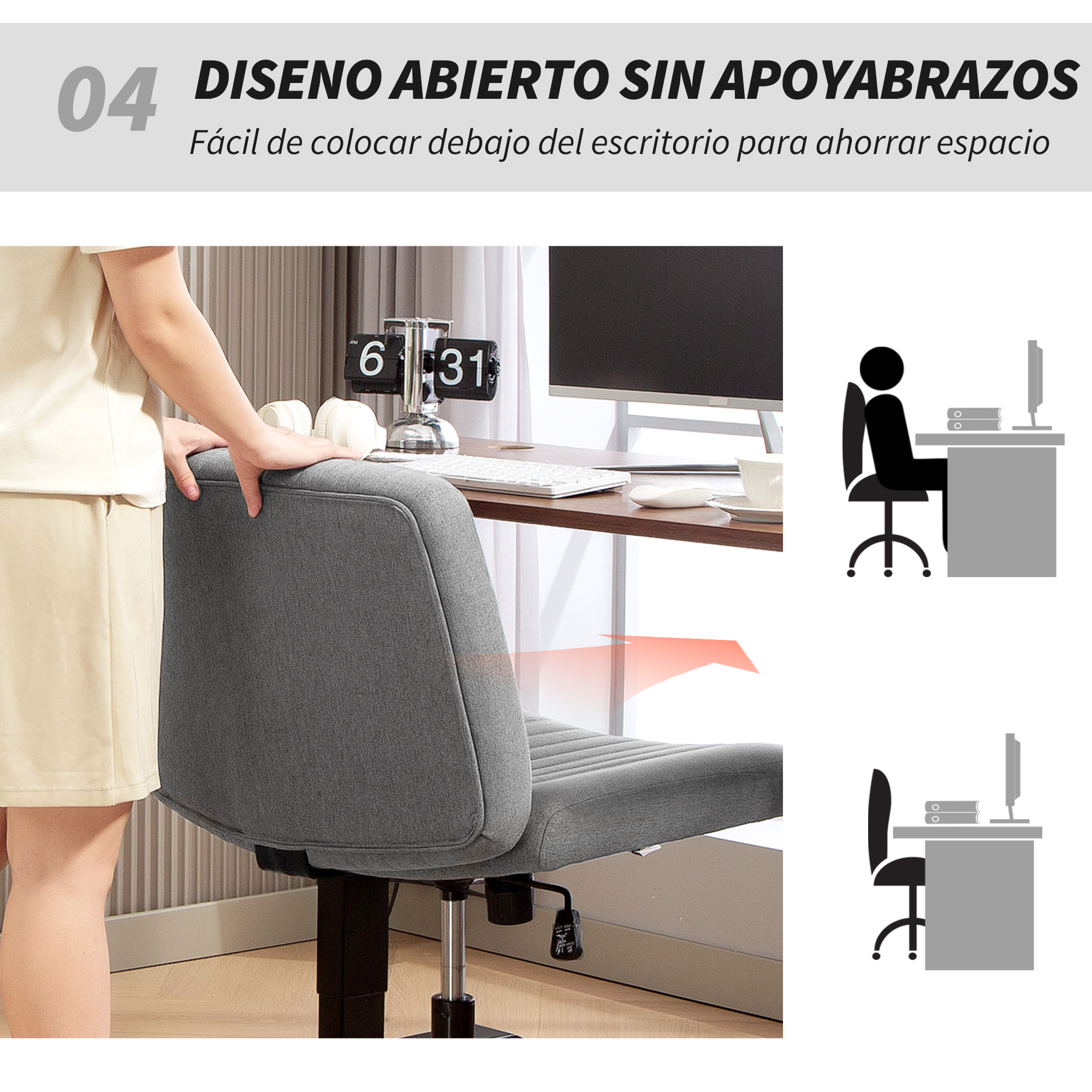 Silla de oficina gris sin reposabrazos, cerca de un escritorio con computadoras.