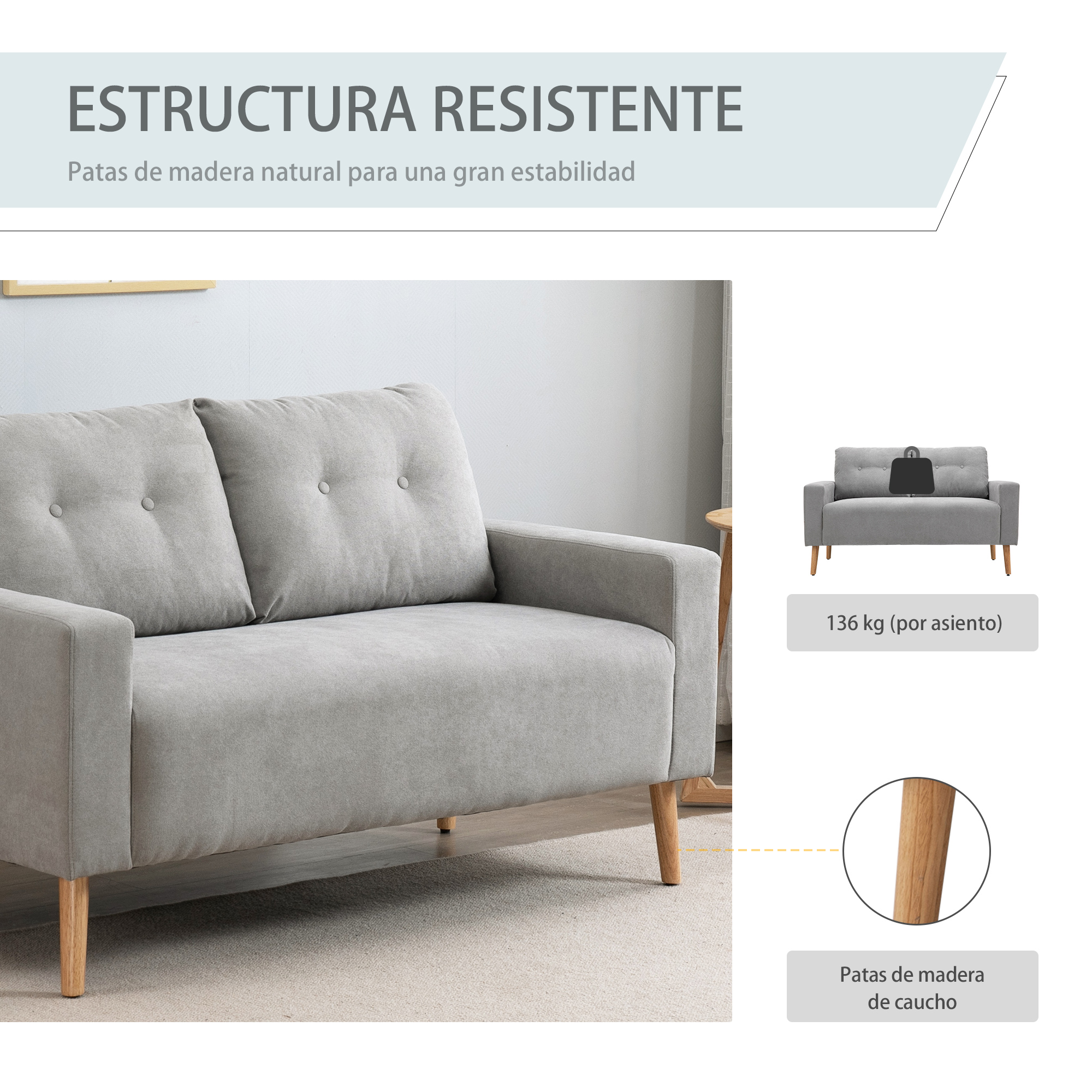Un sofá gris con patas de madera y cojines abotonados.