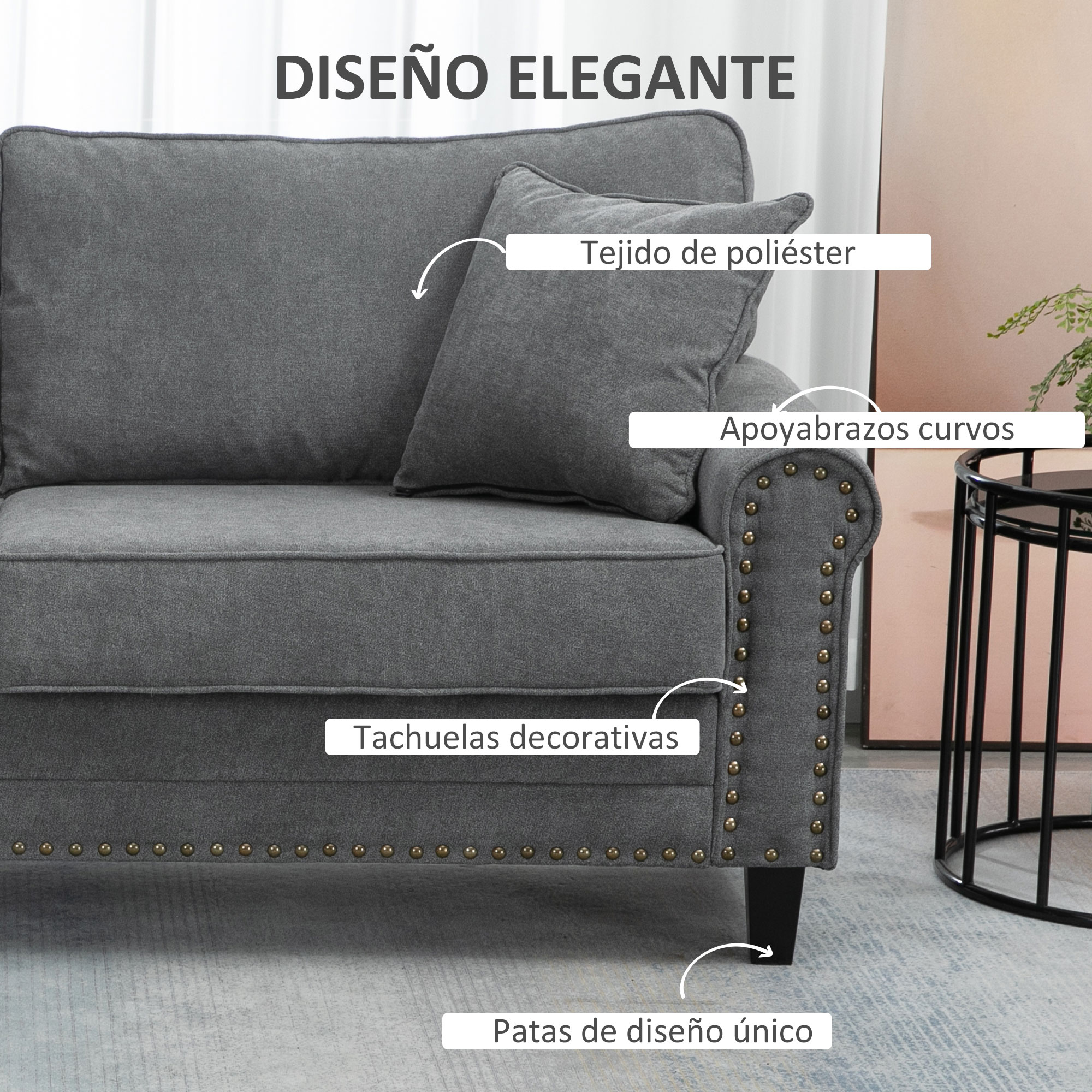 Sofá de tela gris con tachuelas decorativas, reposabrazos curvos y patas únicas.