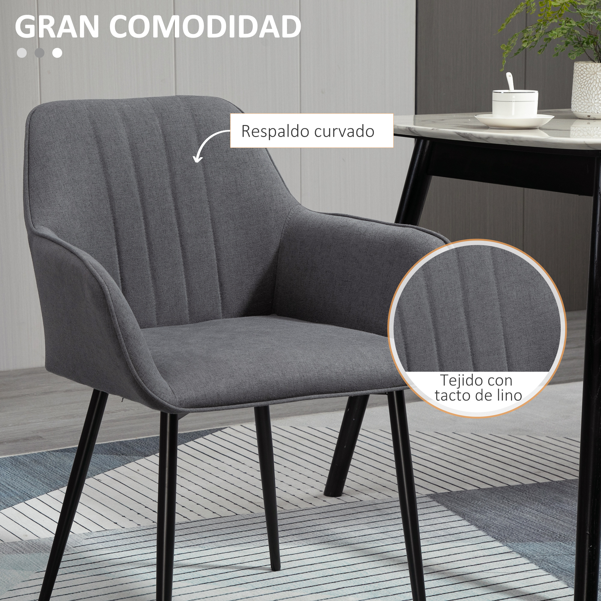 Una silla gris con respaldo curvo y patas negras de metal.