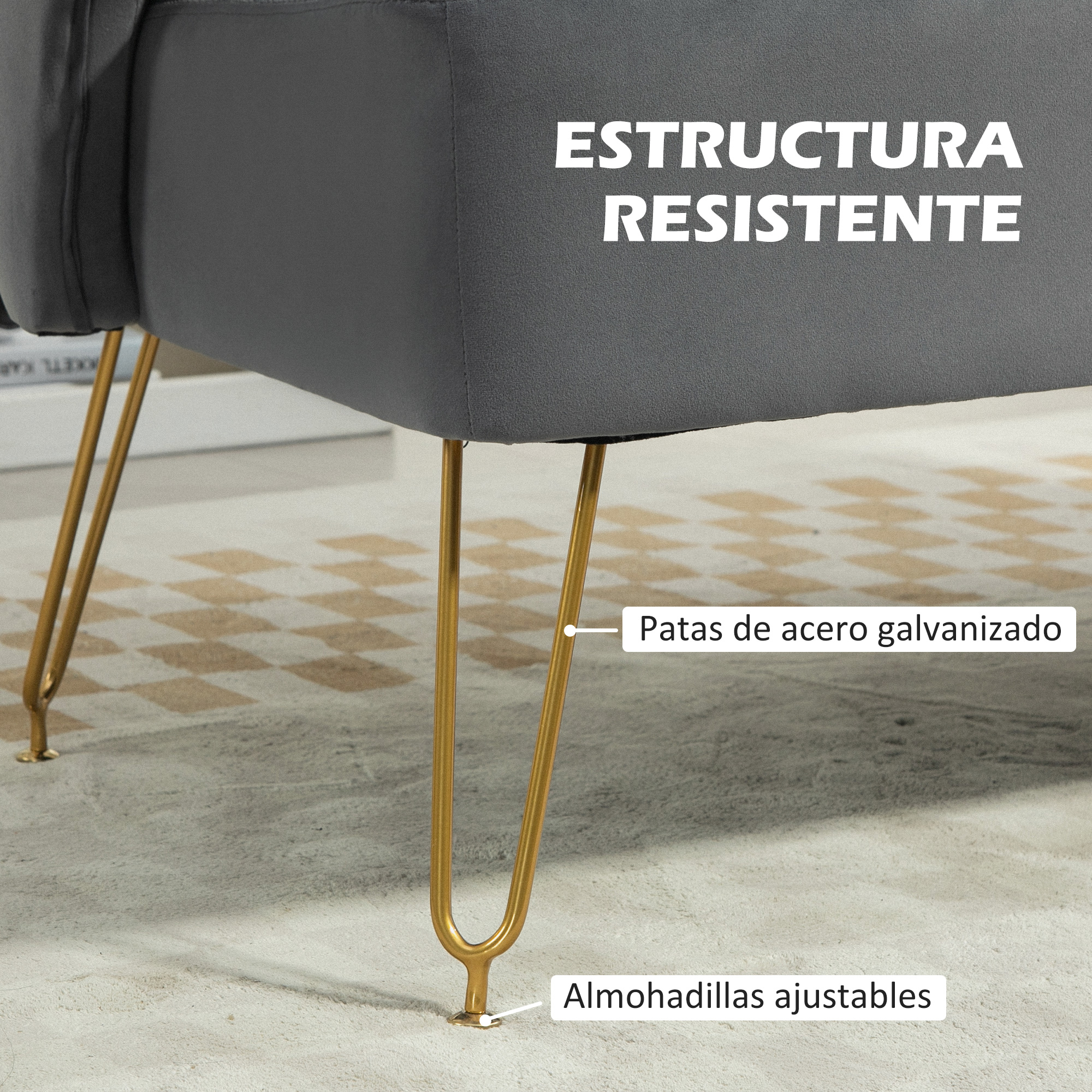 Sillón gris con patas de acero dorado sobre alfombra a cuadros.