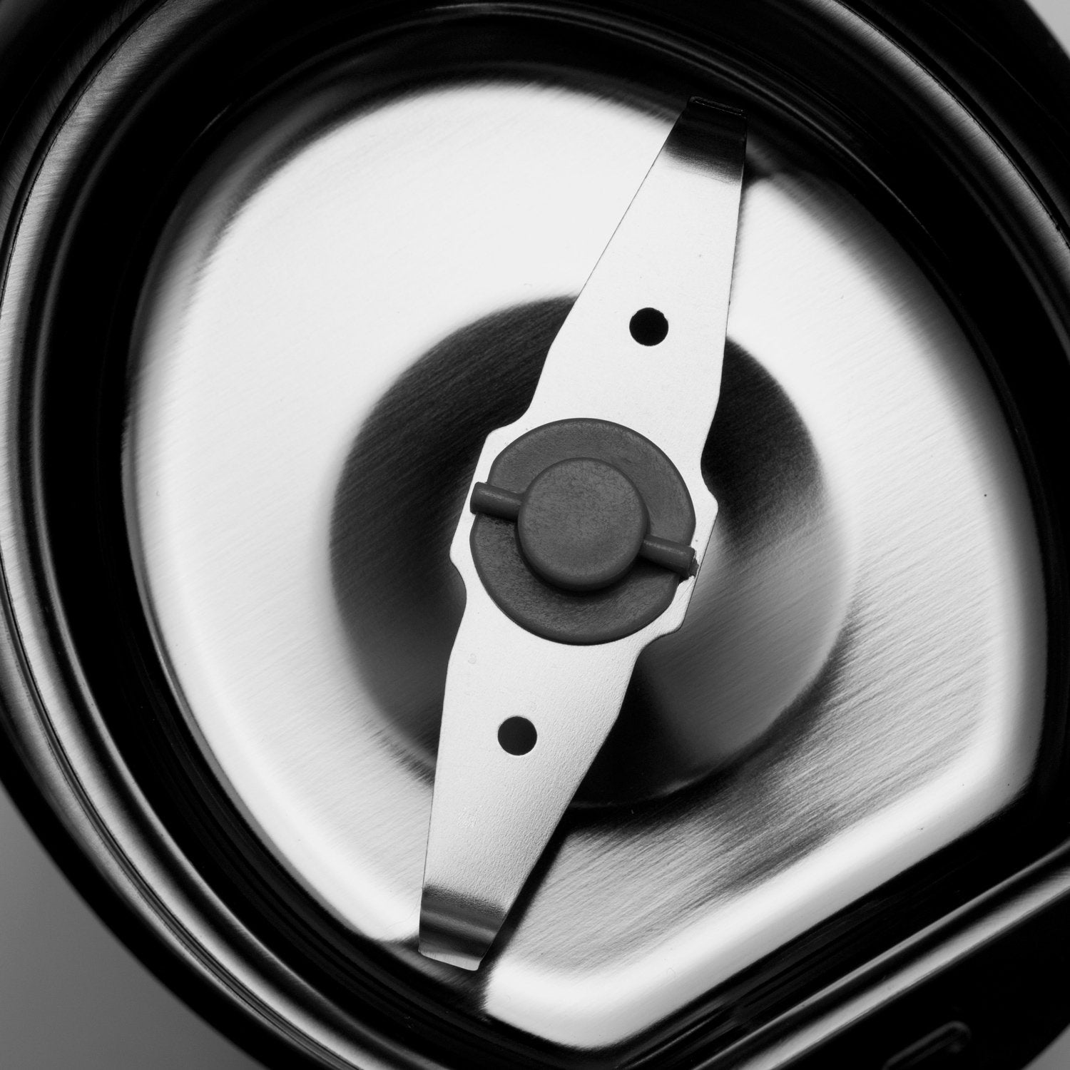 Close-up view of metal grinder blades with a polished surface.