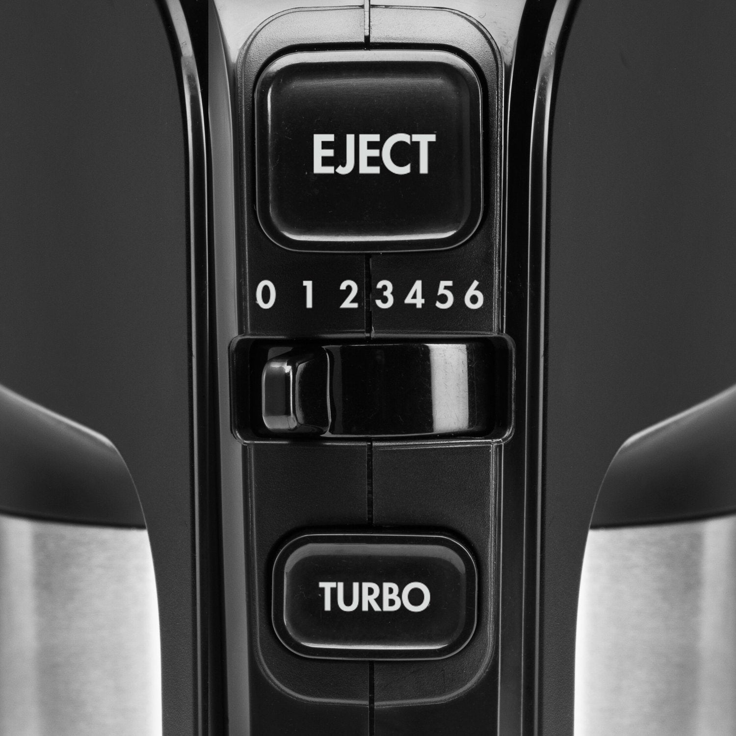 Close-up of a black mixer's controls, showing Eject and Turbo buttons and speed settings.