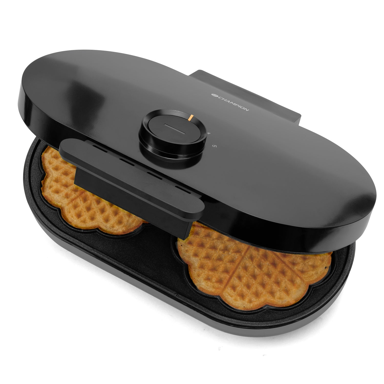 A black waffle maker with two heart-shaped waffles inside, open on a white background.