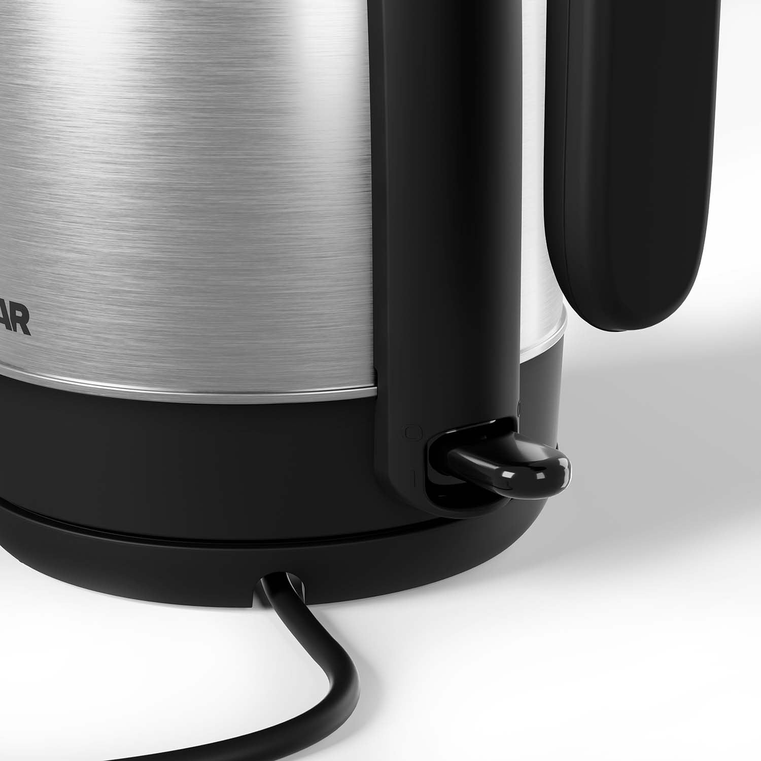 Close-up of a silver kettle with a black handle and switch.