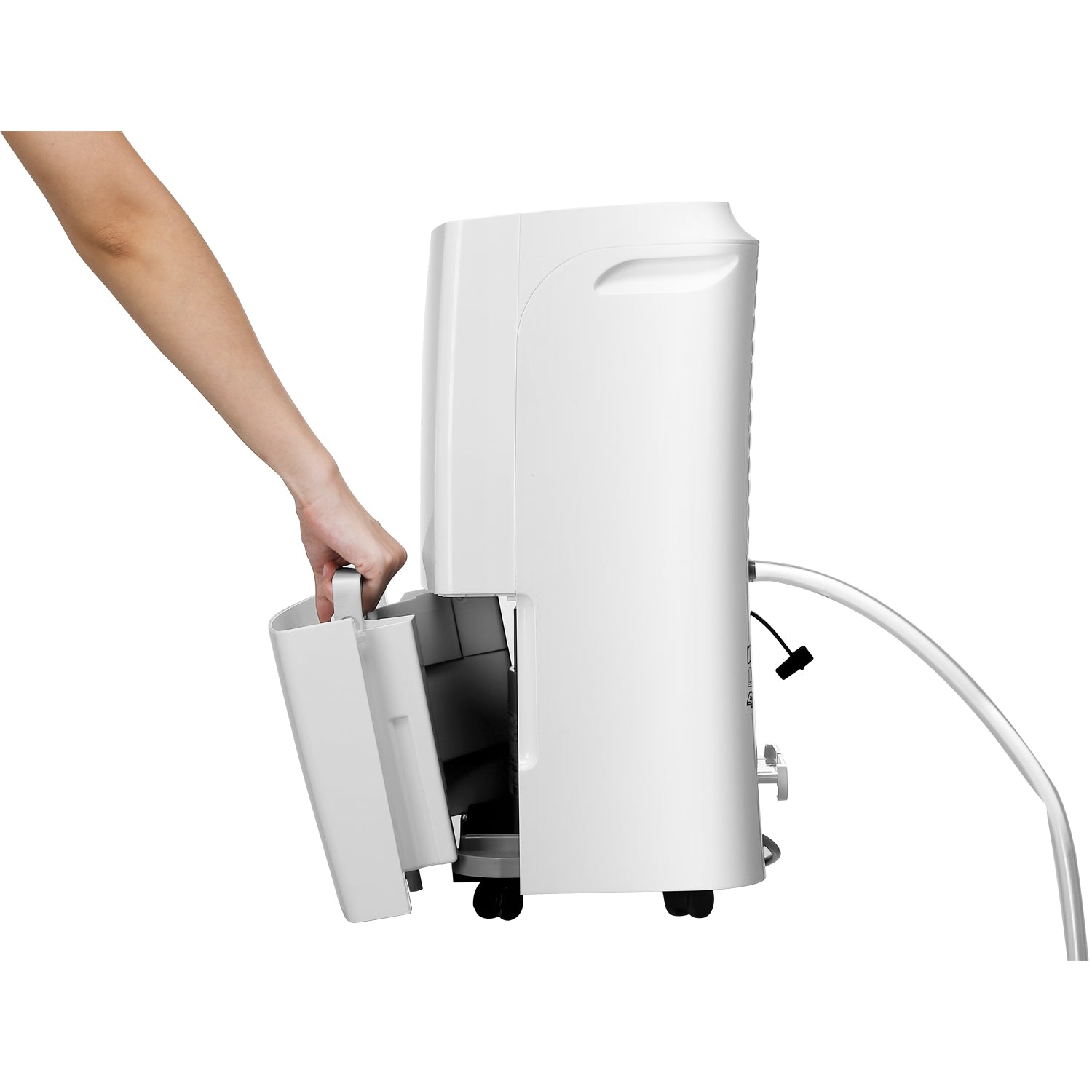 A hand pulls a white bin from a white dehumidifier.