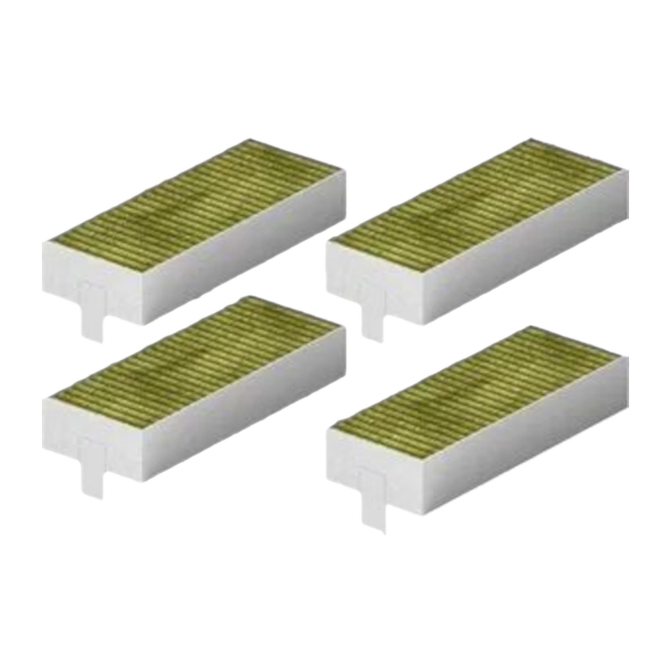 Cztery małe zielone filtry z białymi obramowaniami na białym tle.