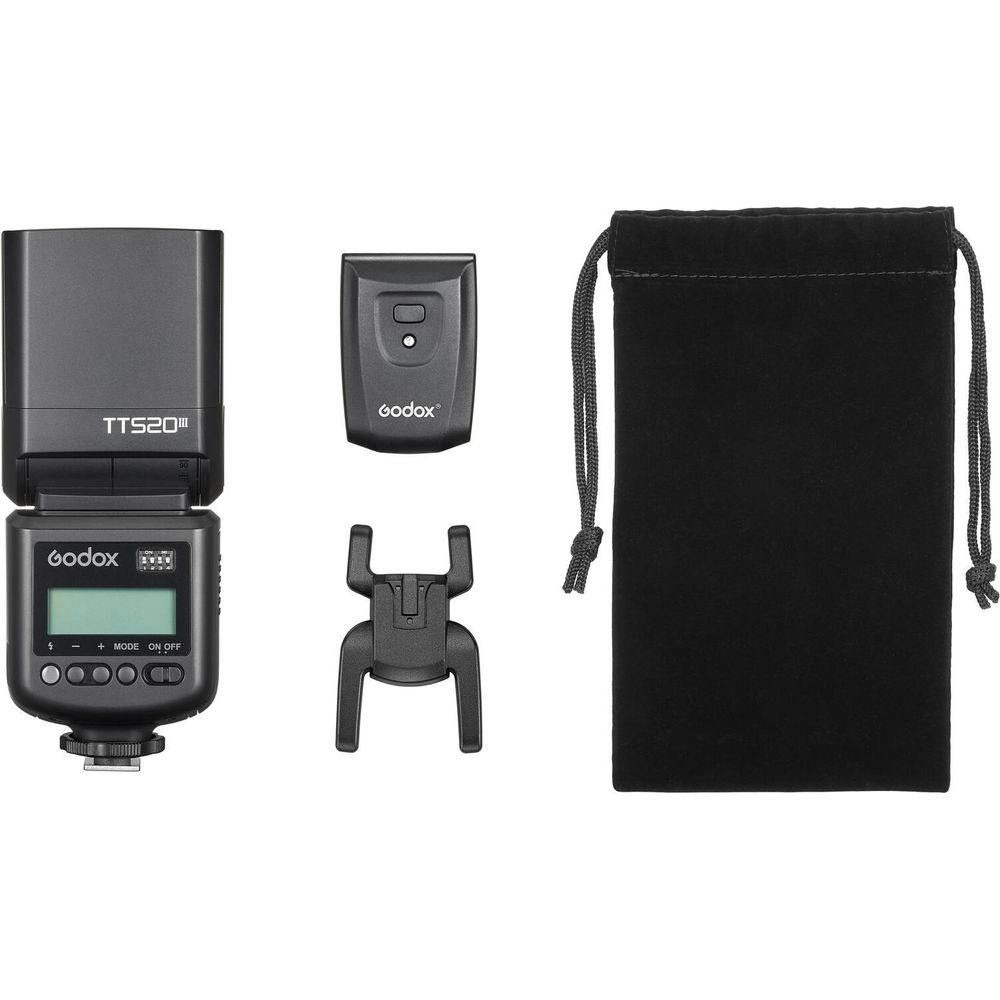 Godox flash unit with accessories: flash head, remote, mount, pouch.