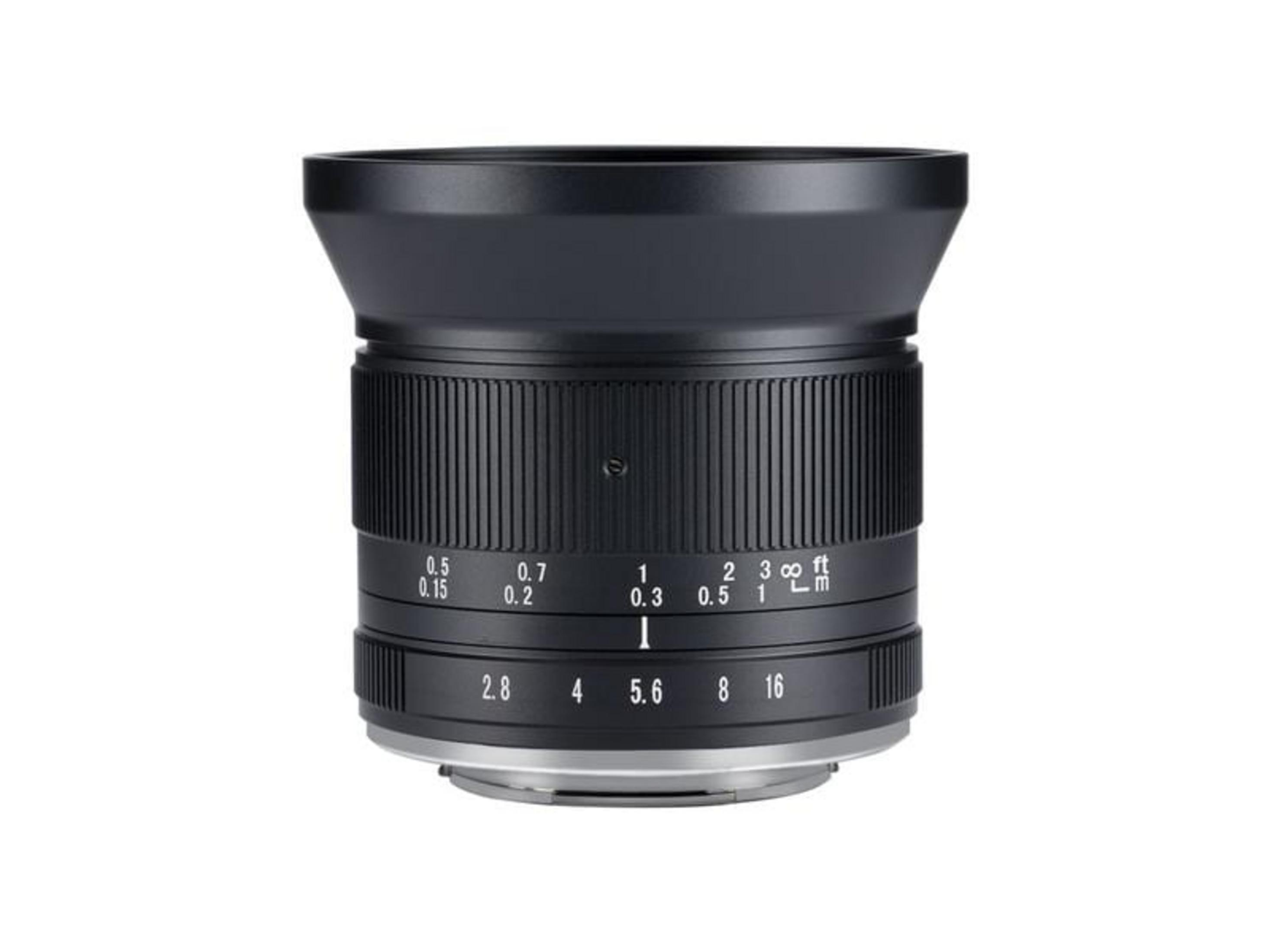 A black camera lens with focus and aperture markings.
