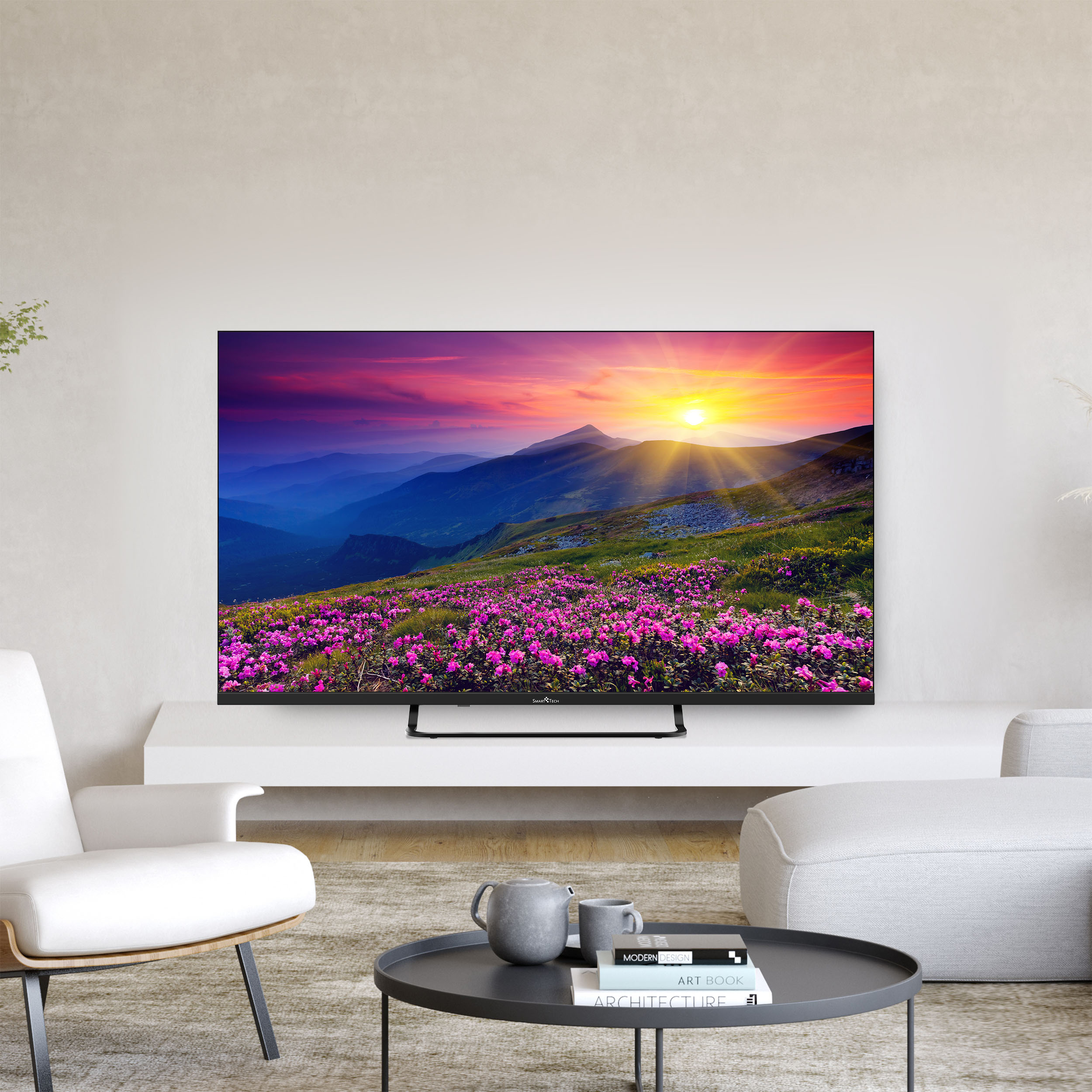 Ein modernes Wohnzimmer mit einem großen Fernseher, der eine Berglandschaft zeigt.