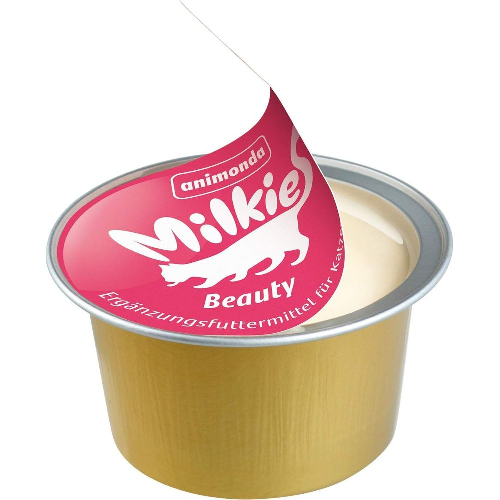 Eine goldene Dose mit Katzenfutter "Milkies Beauty" von animonda.