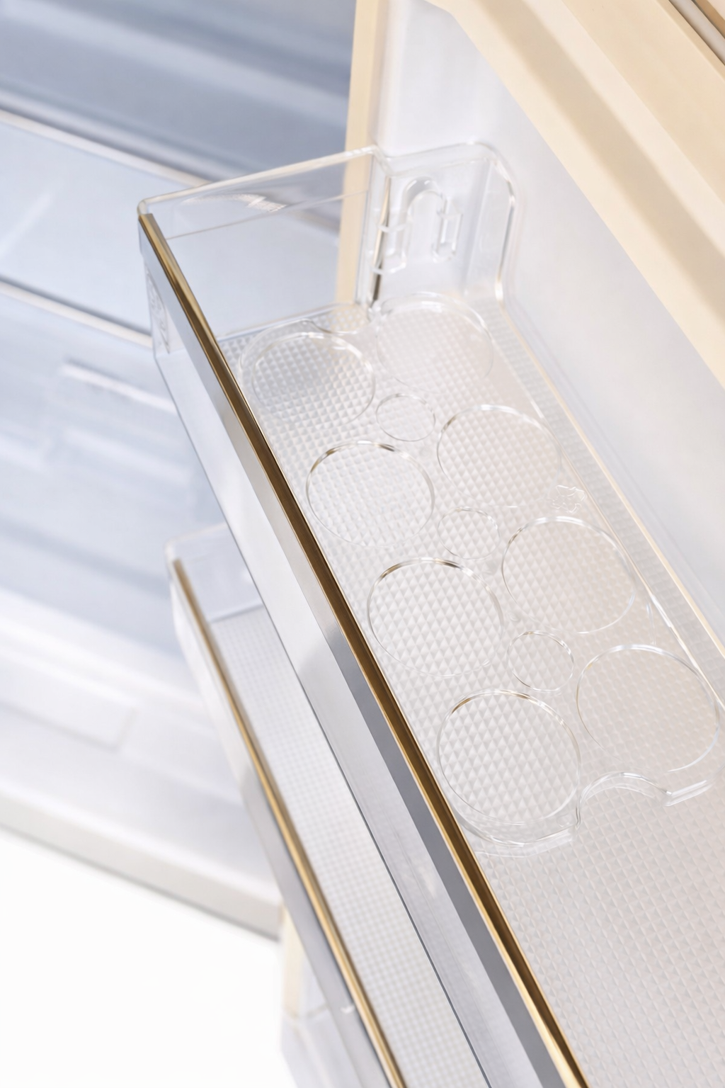 A clear plastic egg holder with multiple circular indentations on a white textured base.