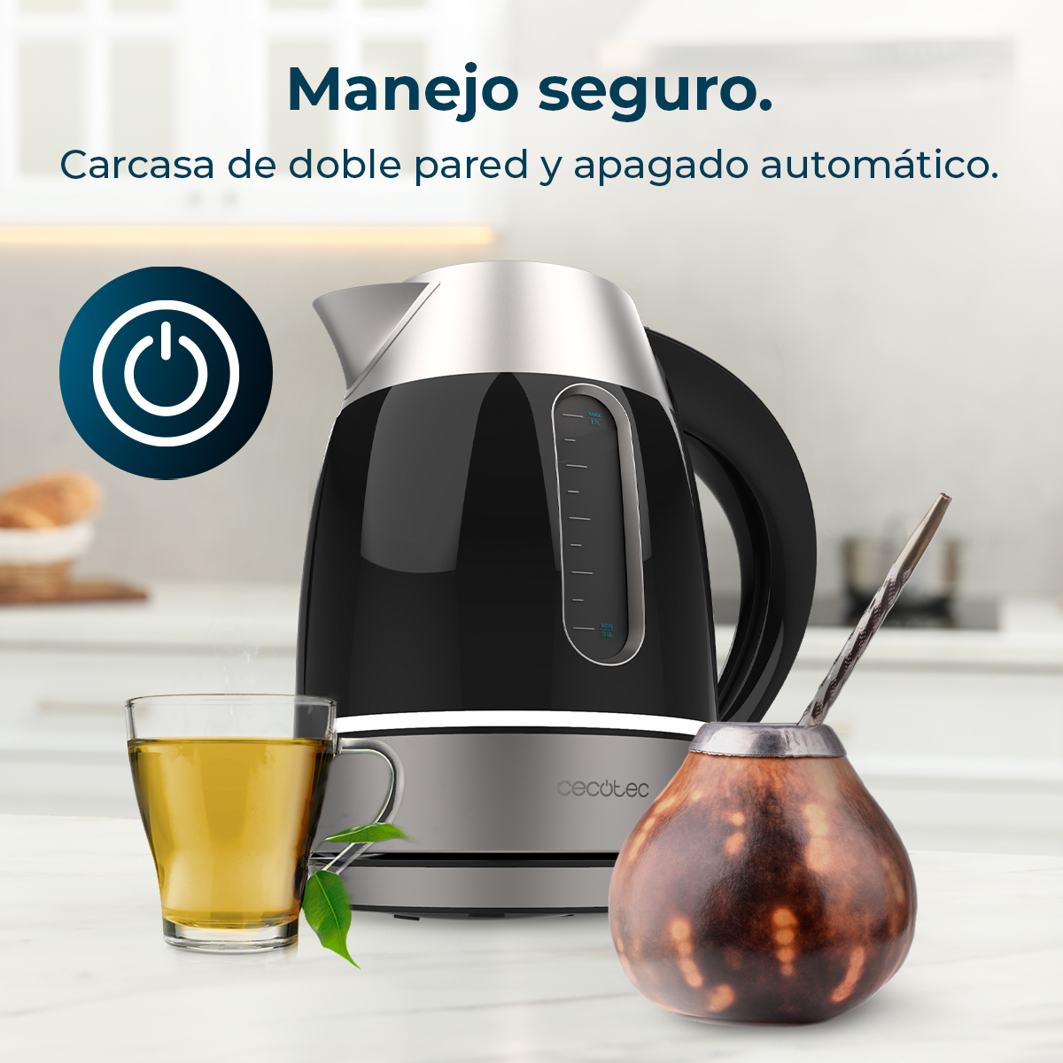 Bollitore nero con bicchiere e tazza da mate. Simbolo di accensione a sinistra.