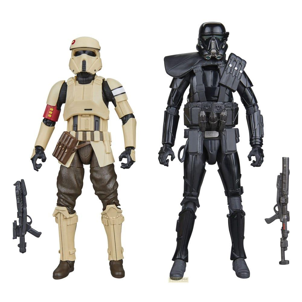 Deux figurines Star Wars, une en armure beige et une en armure noire, avec des blasters.
