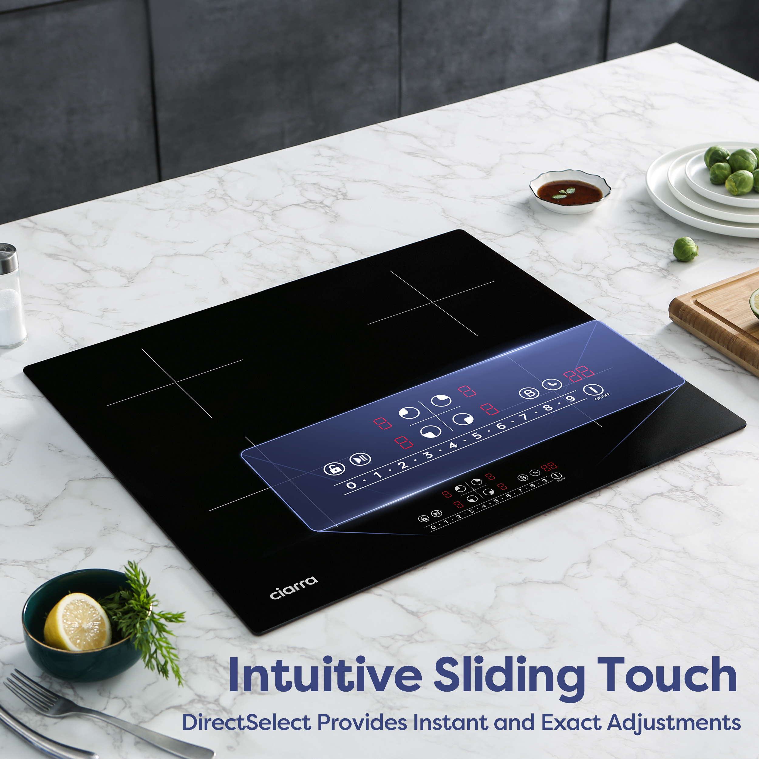 A black induction cooktop with a touchscreen control panel sits on marble.