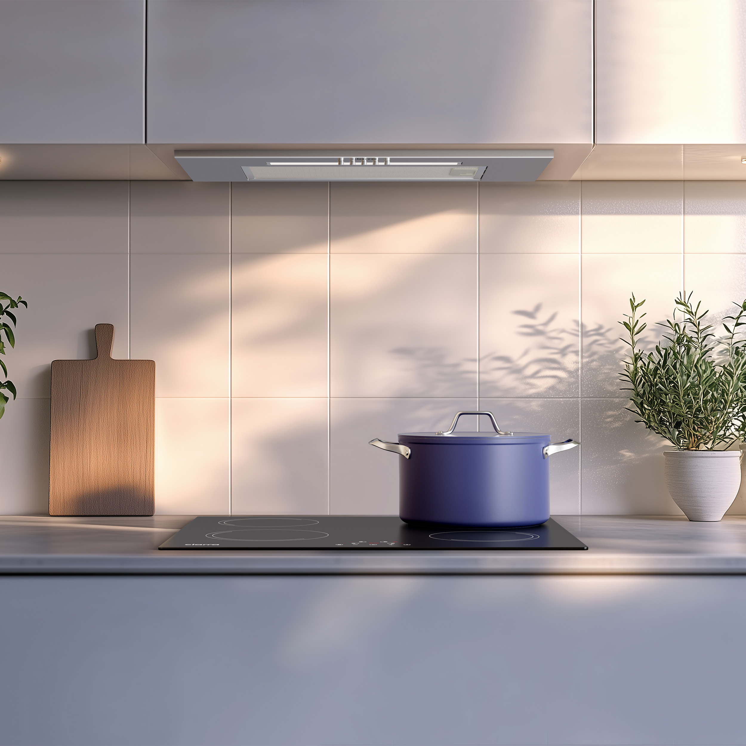 A blue pot sits on an induction stovetop in a modern kitchen.