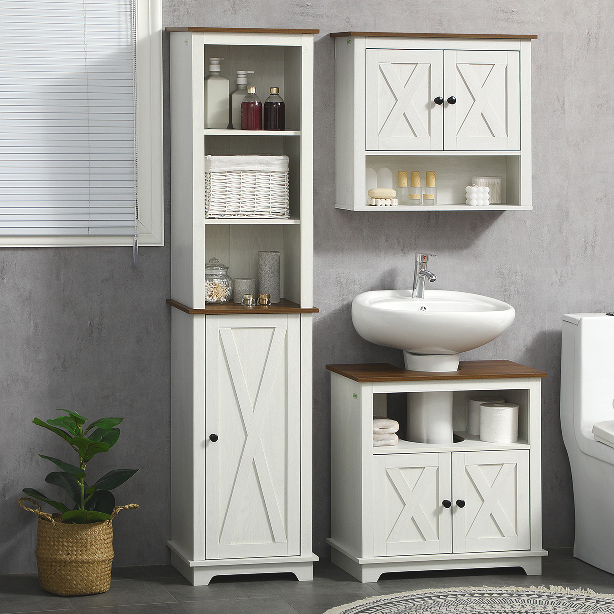 Un baño con armarios de madera blancos, lavabo, inodoro y planta.