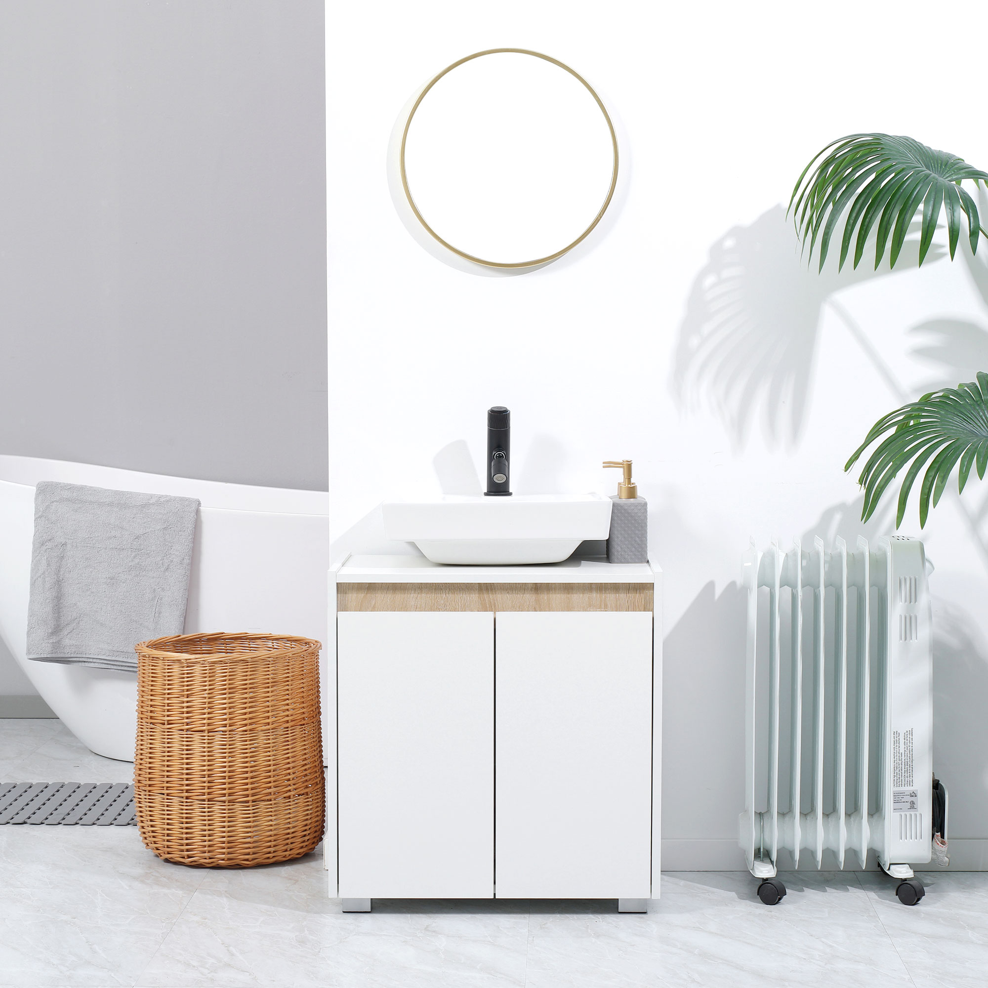 Un baño con bañera, mueble de lavabo, radiador y cesta.