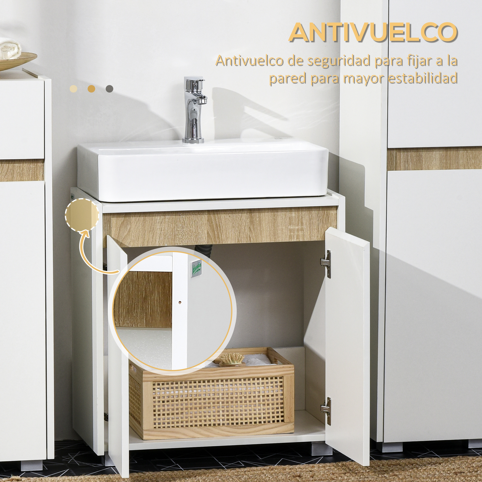 Un lavabo blanco con grifo sobre un mueble de madera con puertas abiertas.