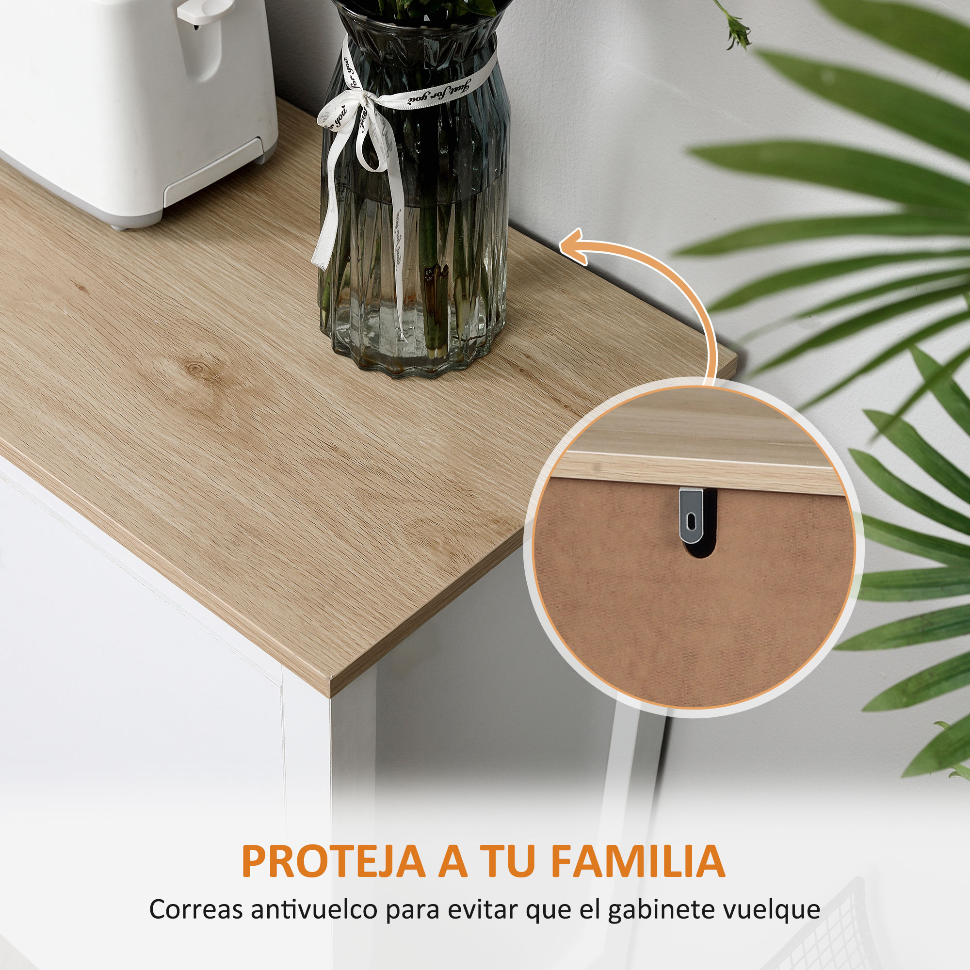 Una tostadora blanca y un jarrón con flores sobre un mueble de madera.