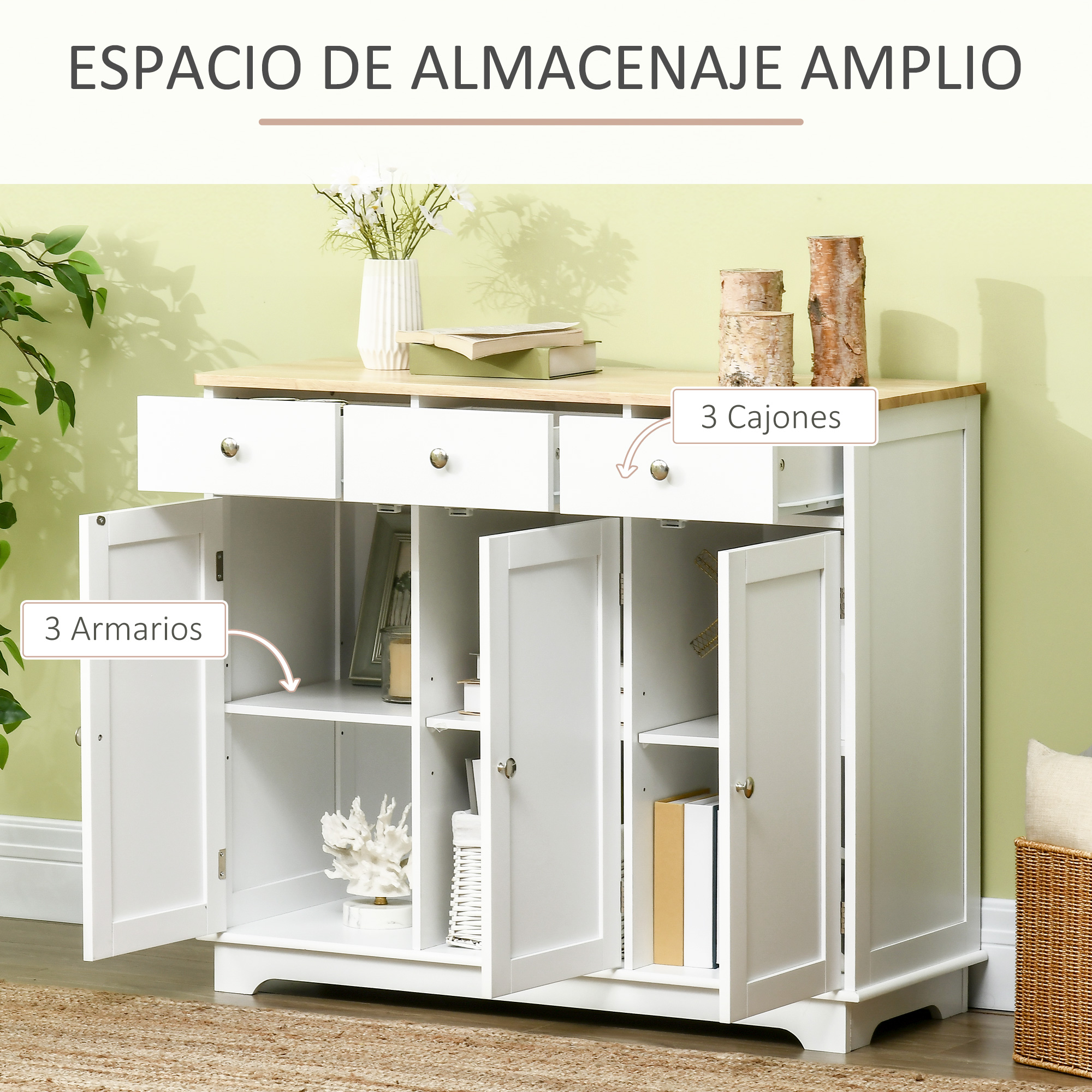 Un mueble blanco con tres cajones y tres compartimentos, decorado con libros y plantas.