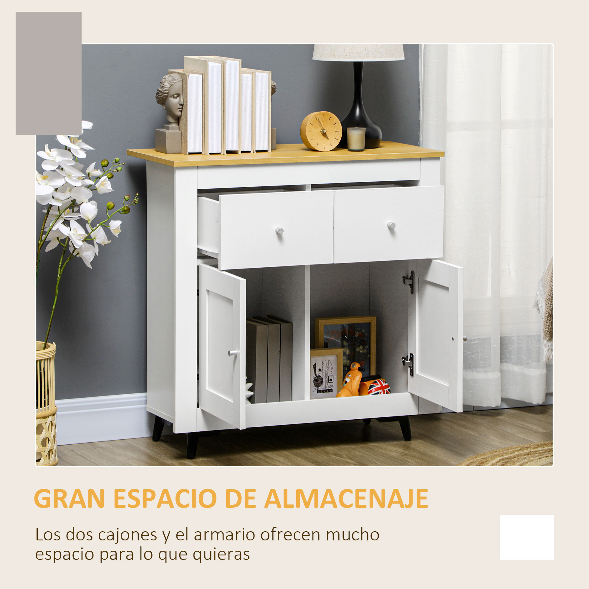 Armario blanco con dos cajones y compartimentos abiertos. Decoraciones en el estante.