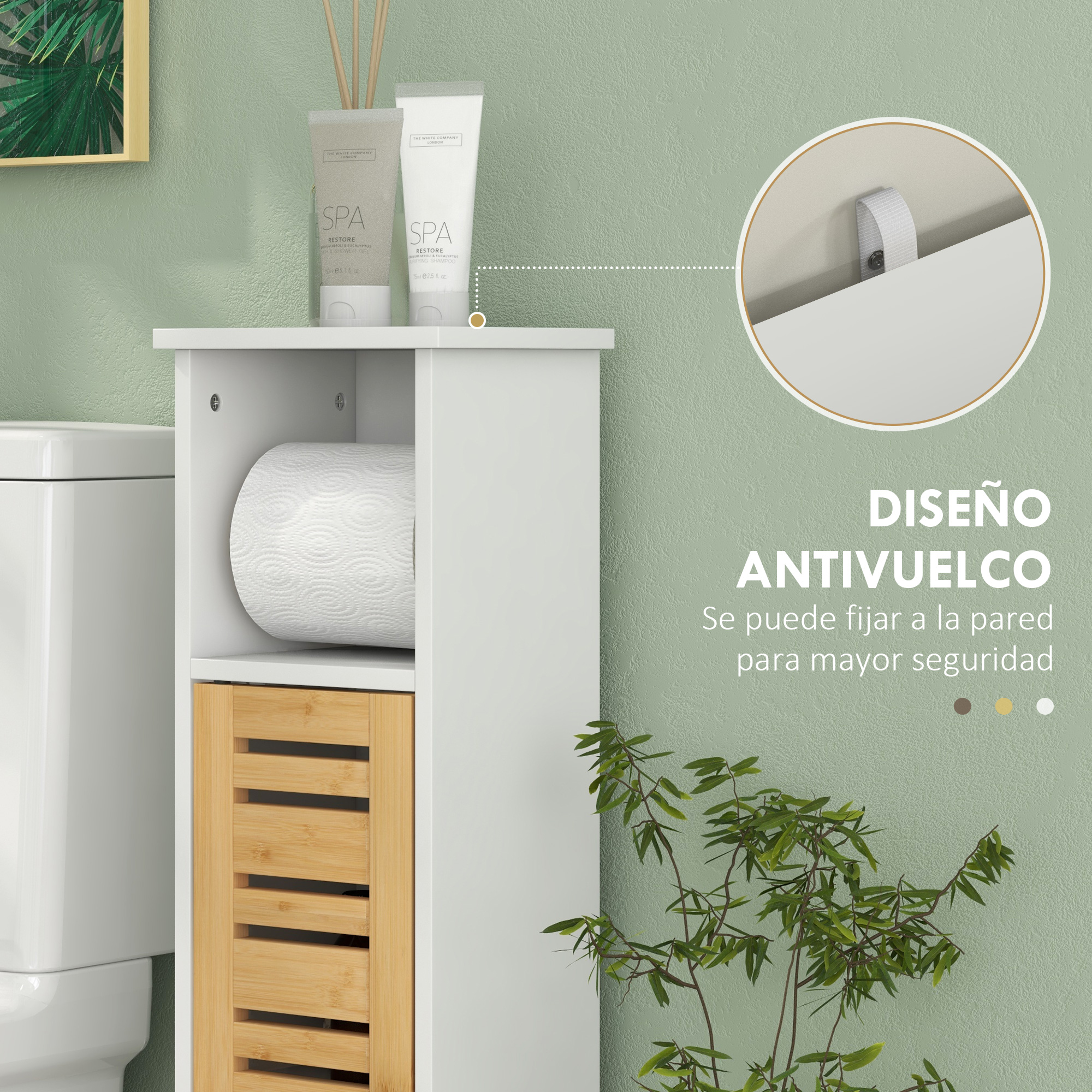 Un mueble blanco junto a un inodoro con rollo de papel y plantas.