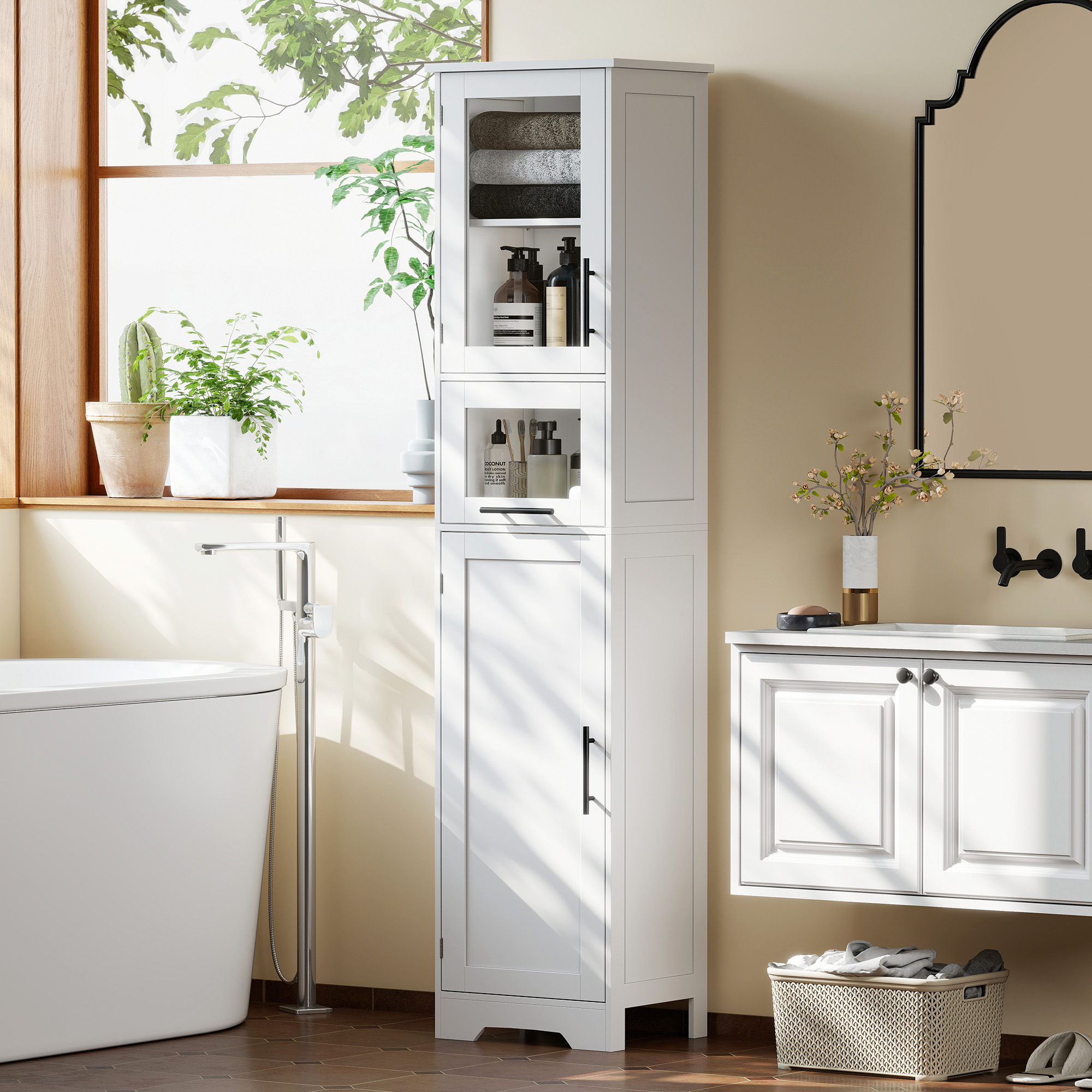 Un mueble de baño blanco con frente de cristal, lleno de toallas y botellas.