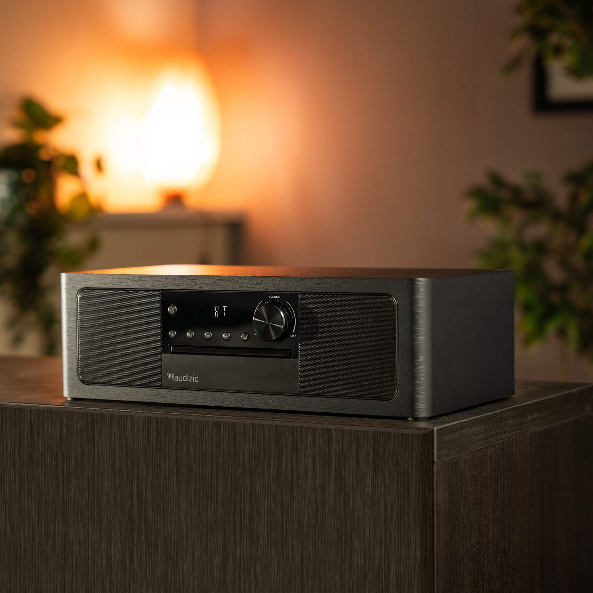 A black Audizio CD receiver with speakers and a volume dial.