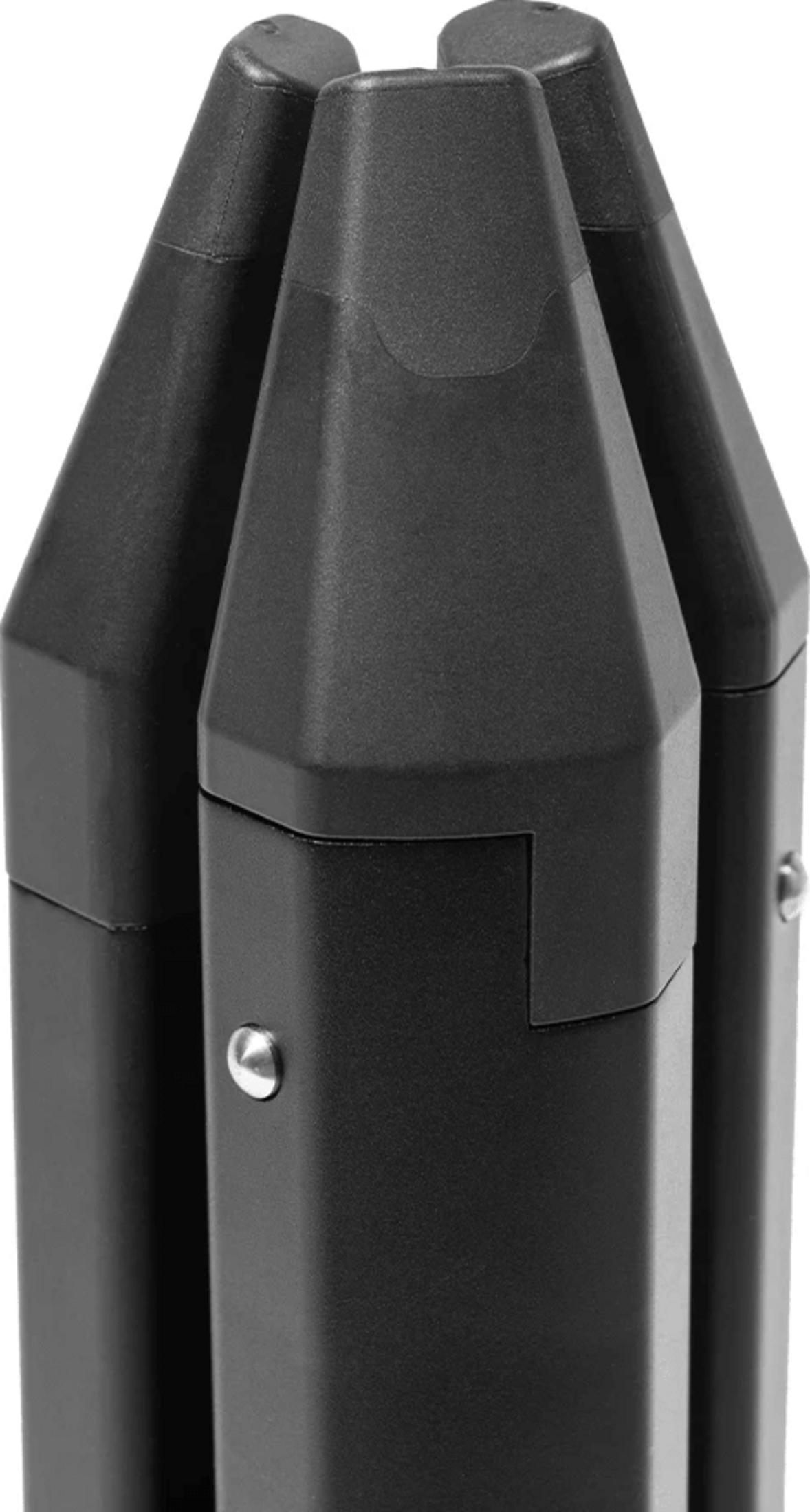 Three black, hexagonal columns with pointed tops, close up.