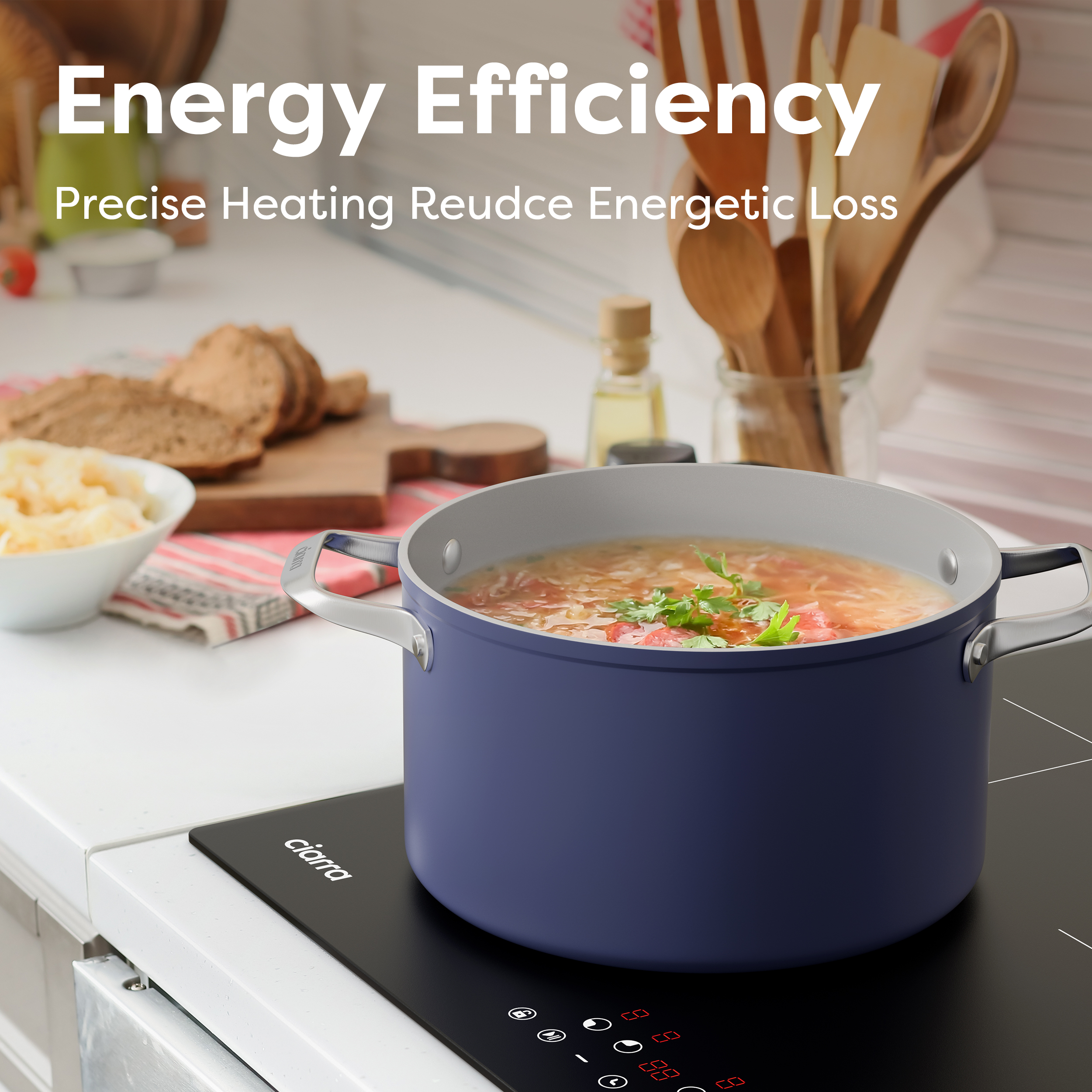 Une cocotte bleue de soupe sur une plaque à induction, avec du pain et de l'huile à proximité.