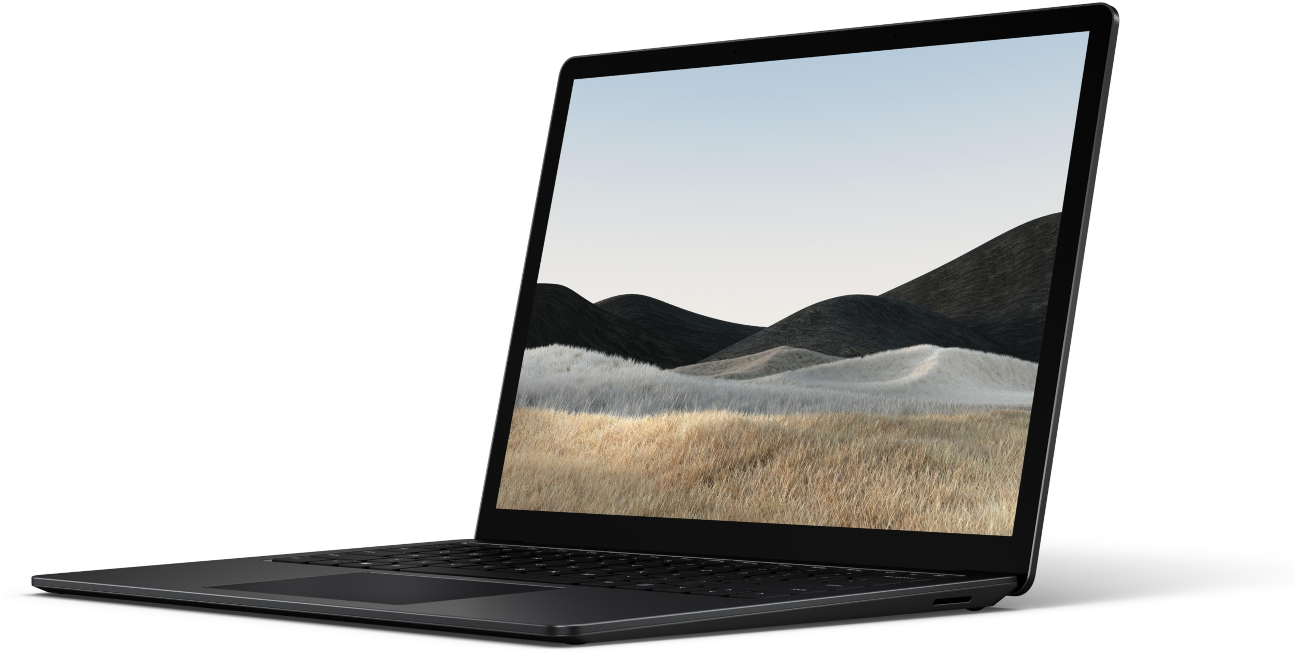 Ein geöffneter schwarzer Laptop steht auf weißem Hintergrund mit einer Landschaft auf dem Bildschirm.