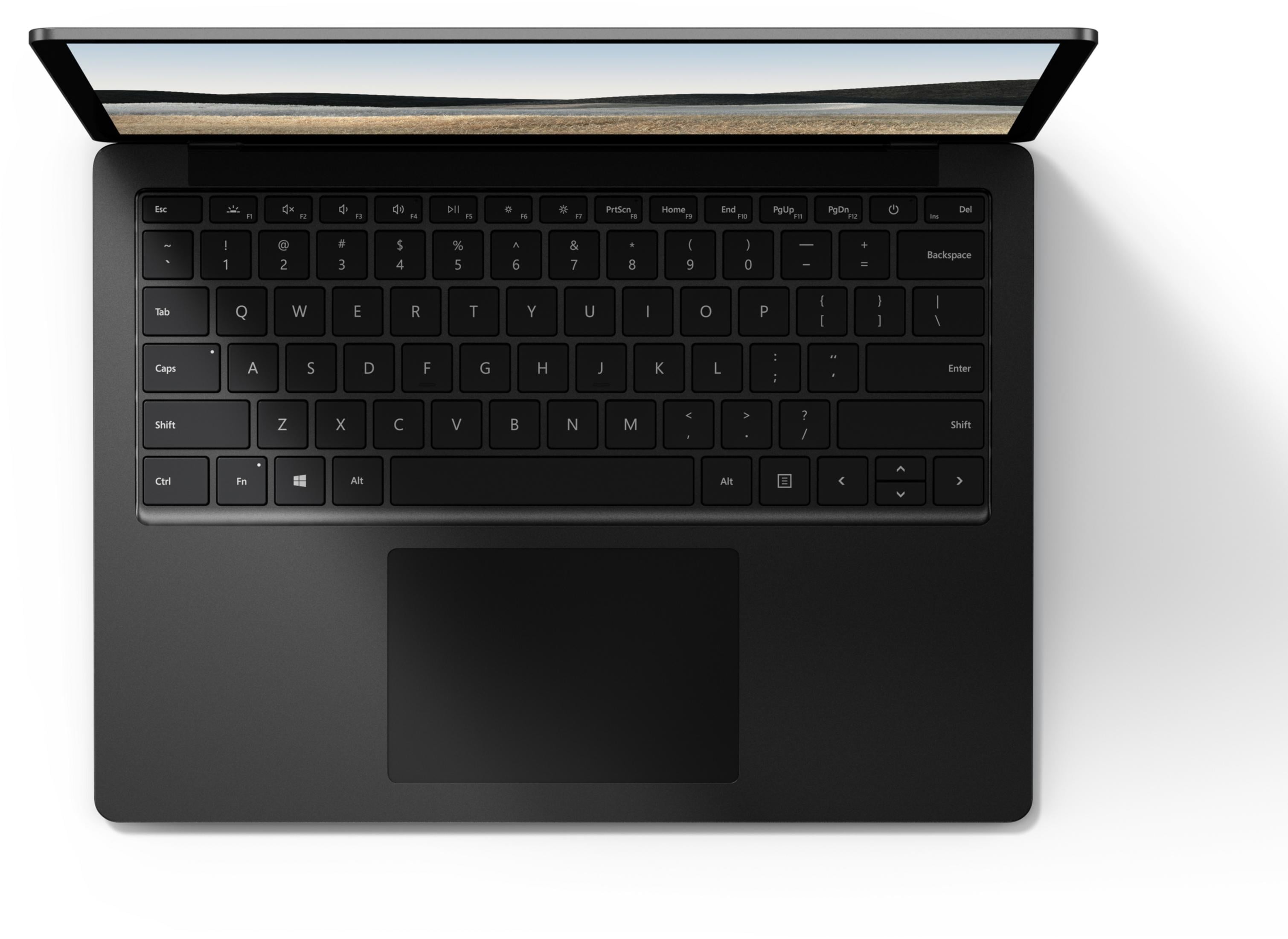 Ein schwarzer Laptop mit geöffnetem Bildschirm, der eine Landschaft zeigt.