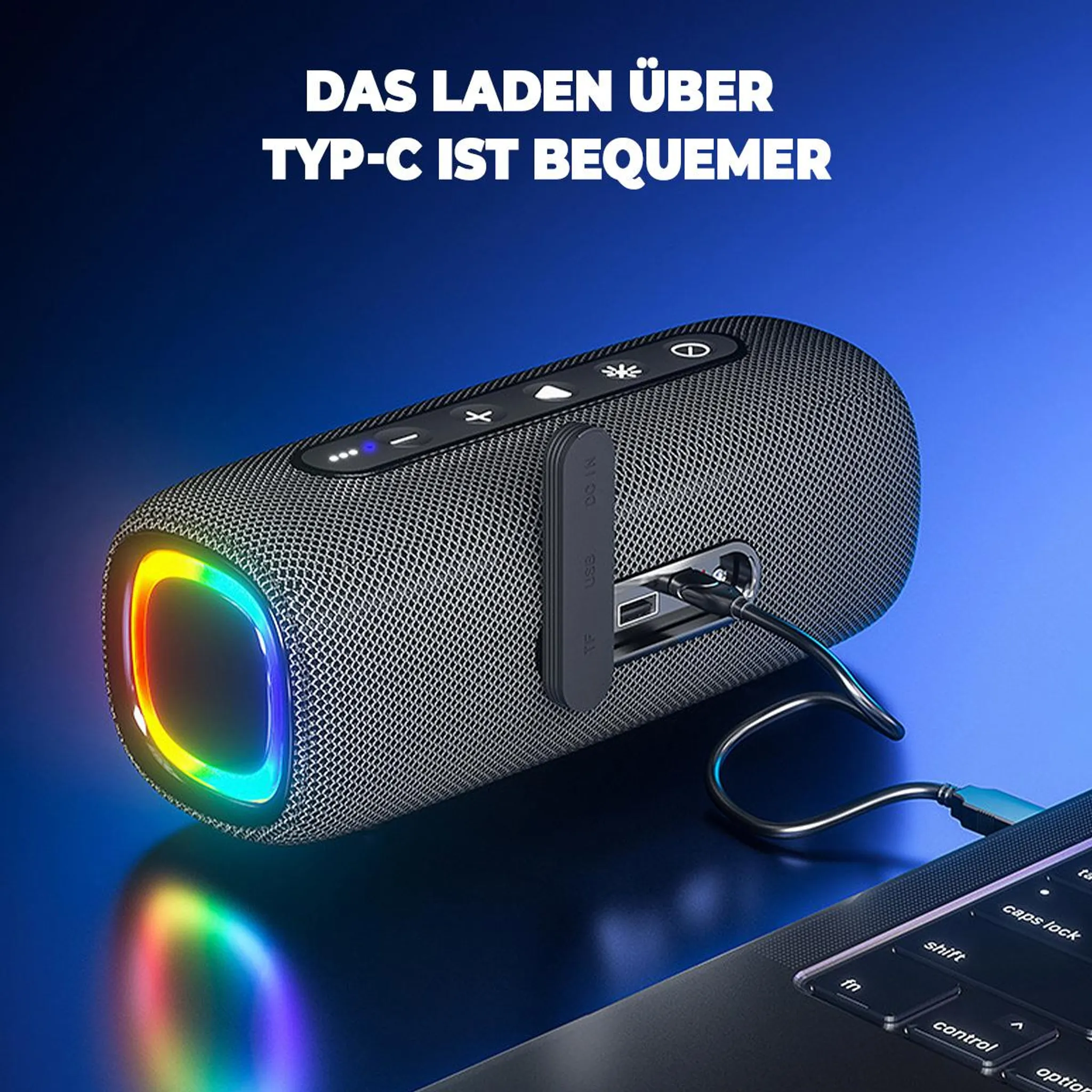 Ein schwarzer Lautsprecher mit RGB-Beleuchtung ist an einen Laptop angeschlossen.